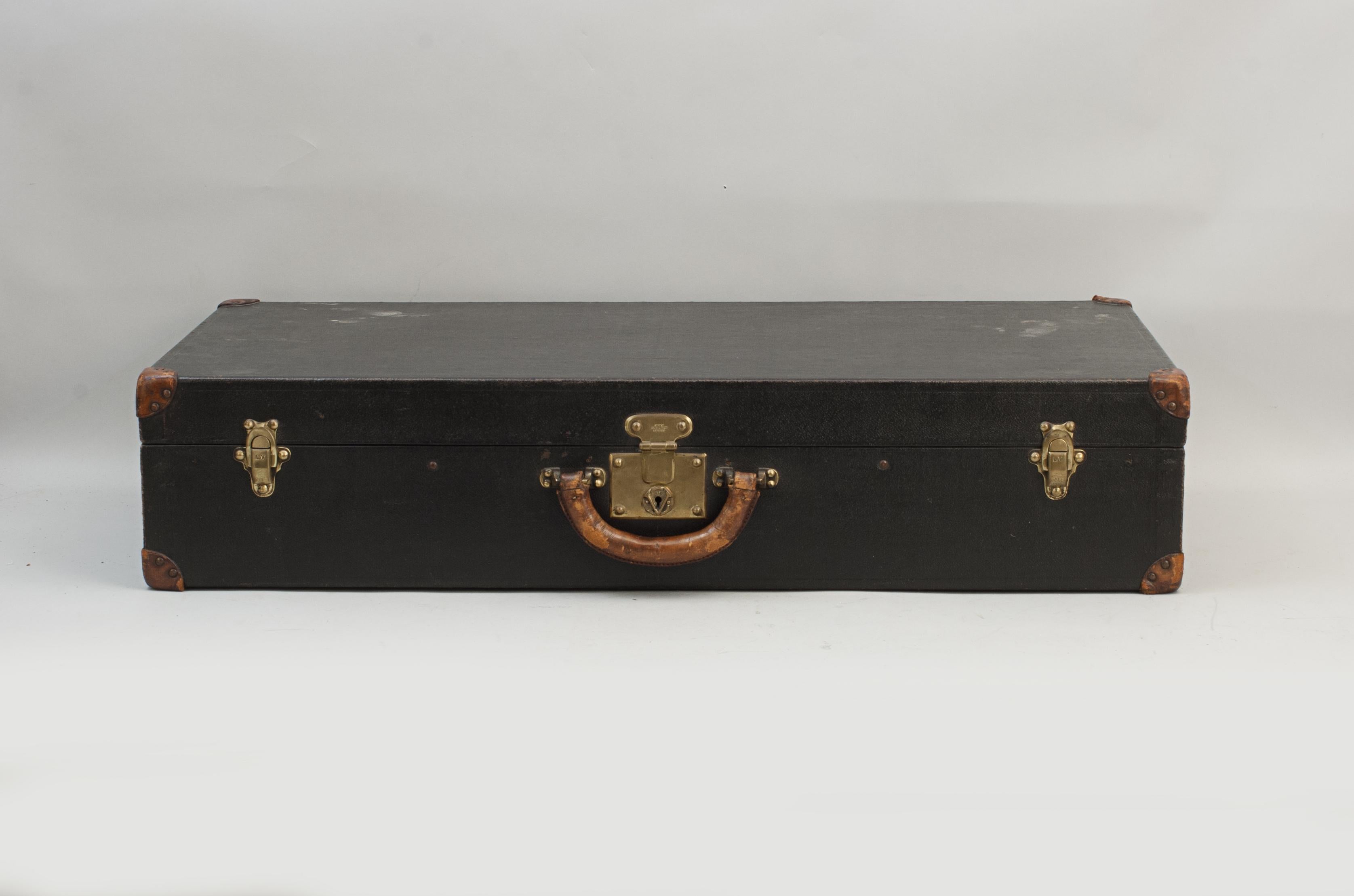 Louis Vuitton Car, Motoring Trunk.
The Louis Vuitton motoring luggage case is in good usable condition with two brass lever clips to keep the lid firmly closed, one central lock and leather carry handle. All brass fittings with 'LV' and there is
