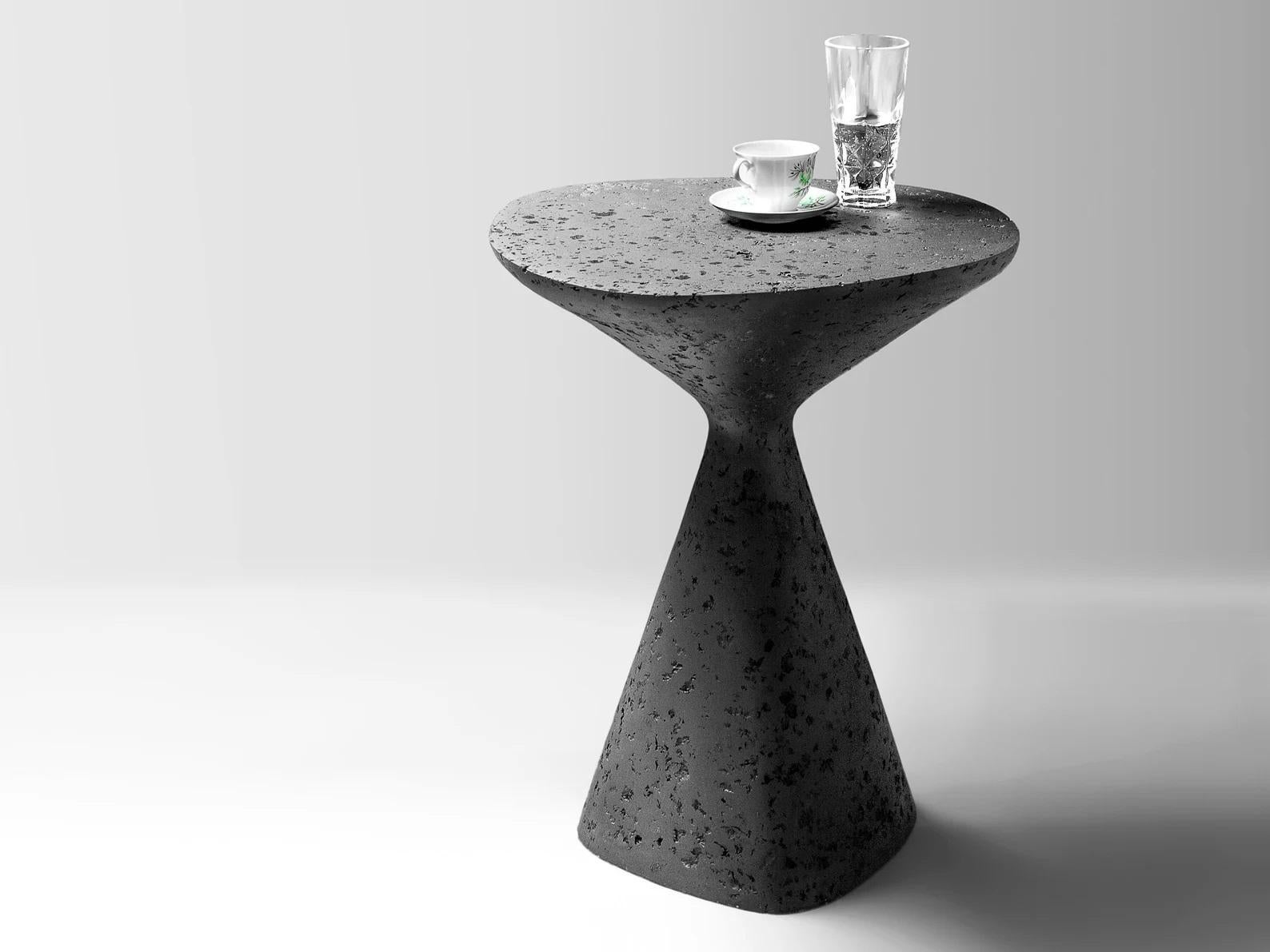 Black Mottled Side Table by Kasanai
Dimensions: D 46 x H 61 cm.
Materials: Cement, recycled paper, glue, paint.
6 kg.

The fusion of sturdiness and elegance, along with the blend of archaism and modernity. More than just a surface for placing