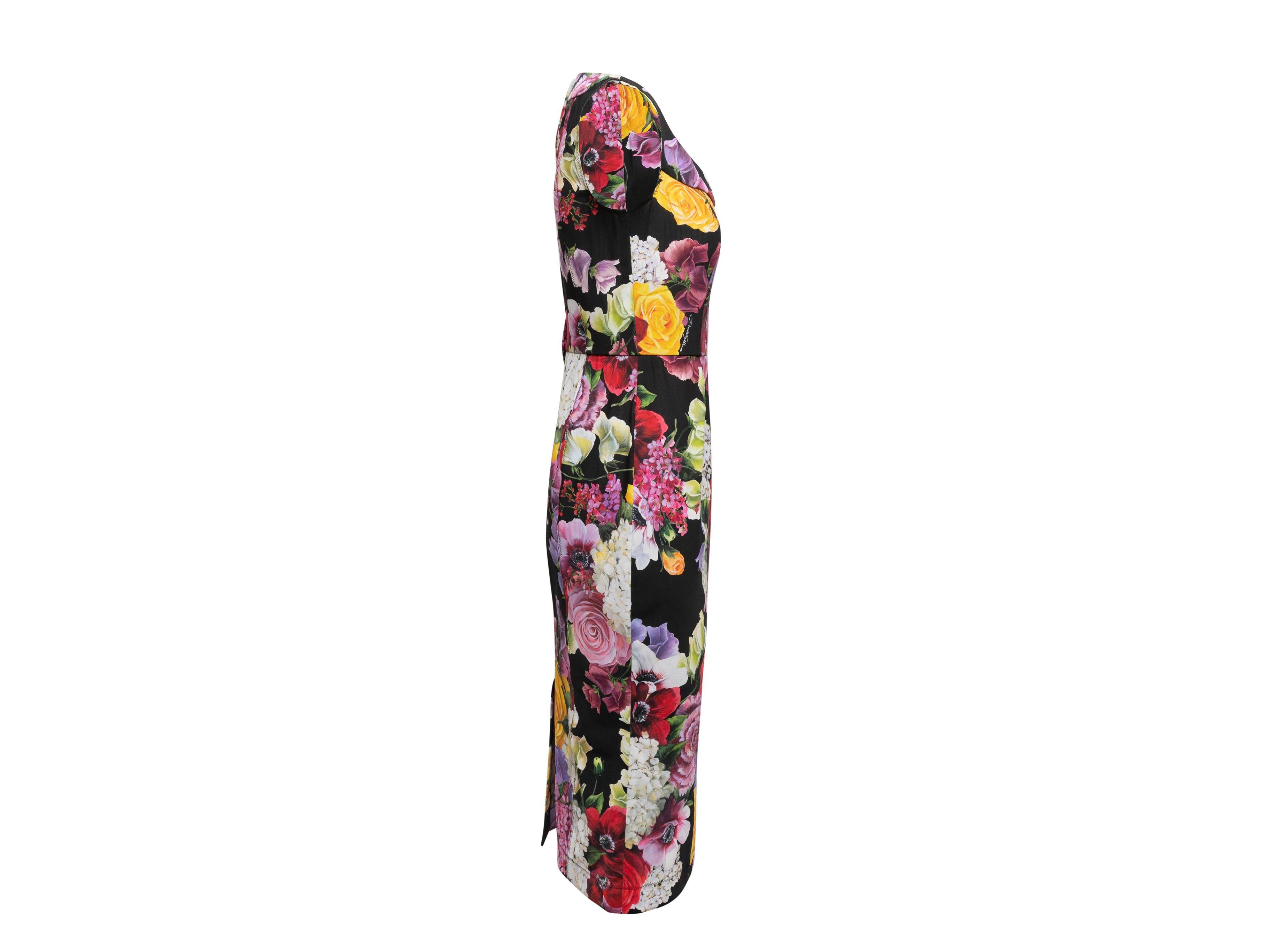 Black and multicolor floral print sleeveless bodycon dress by Dolce & Gabbana. Scoop neckline. Zip closure at center back. 34