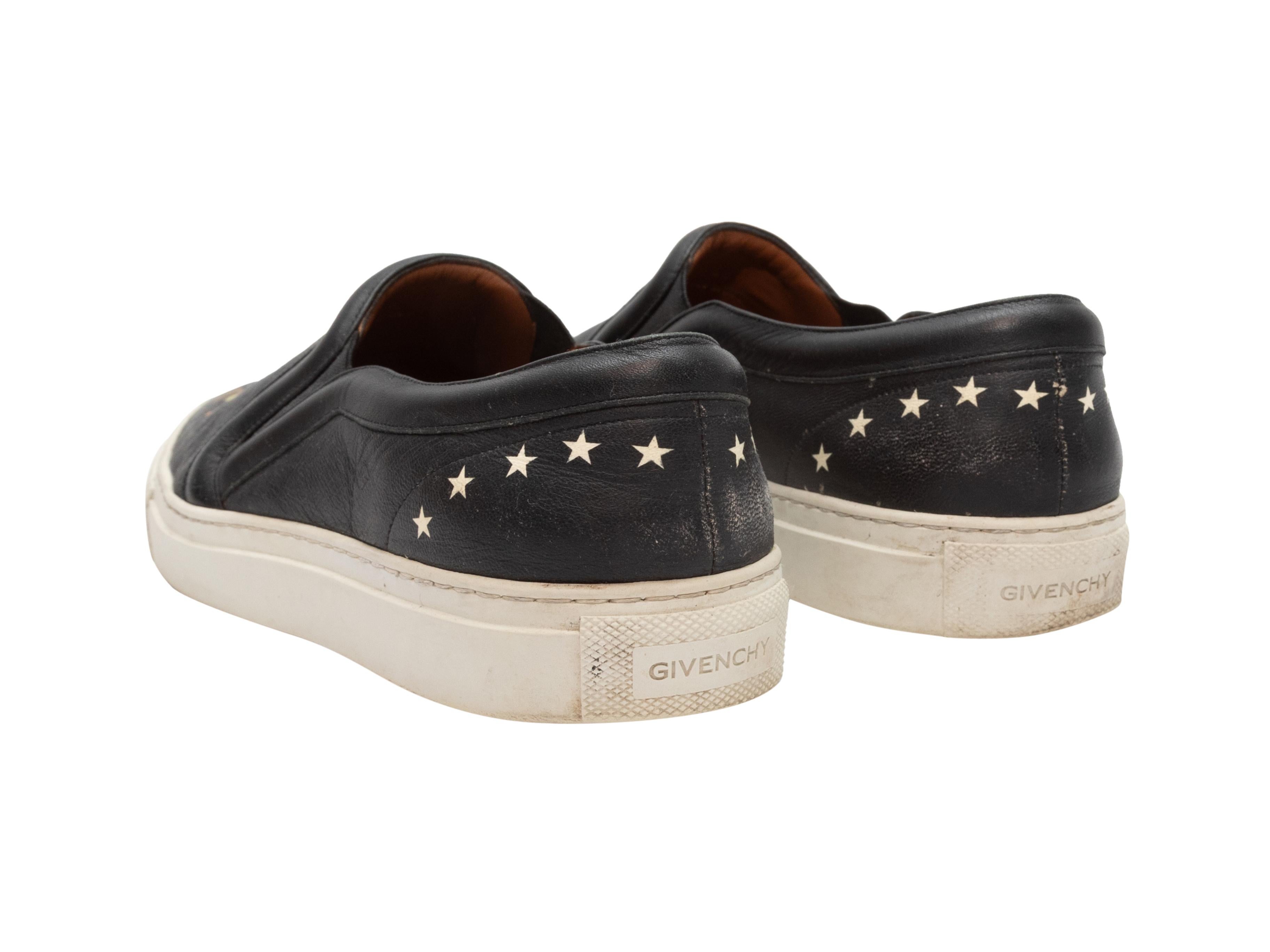 Black and multicolor Rottweiler dog print leather slip-on low-top sneakers by Givenchy. Rubber soles. 1