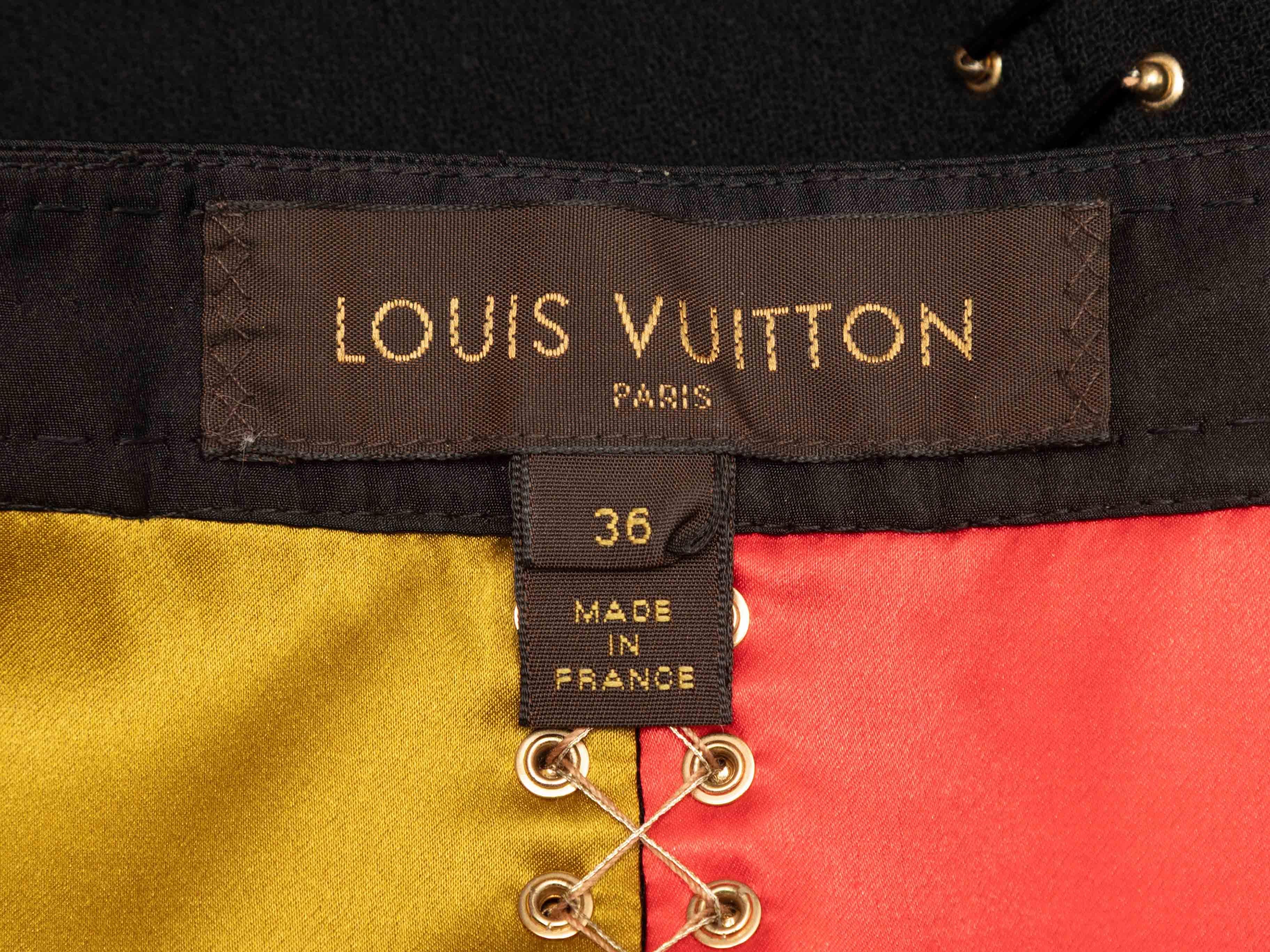 Schwarzer und mehrfarbiger Minirock aus Wolle und Seide mit Ösenbesatz von Louis Vuitton. Goldfarbene Hardware. Ketteldetails an den Hüften. Seitliche Verschlüsse. 27