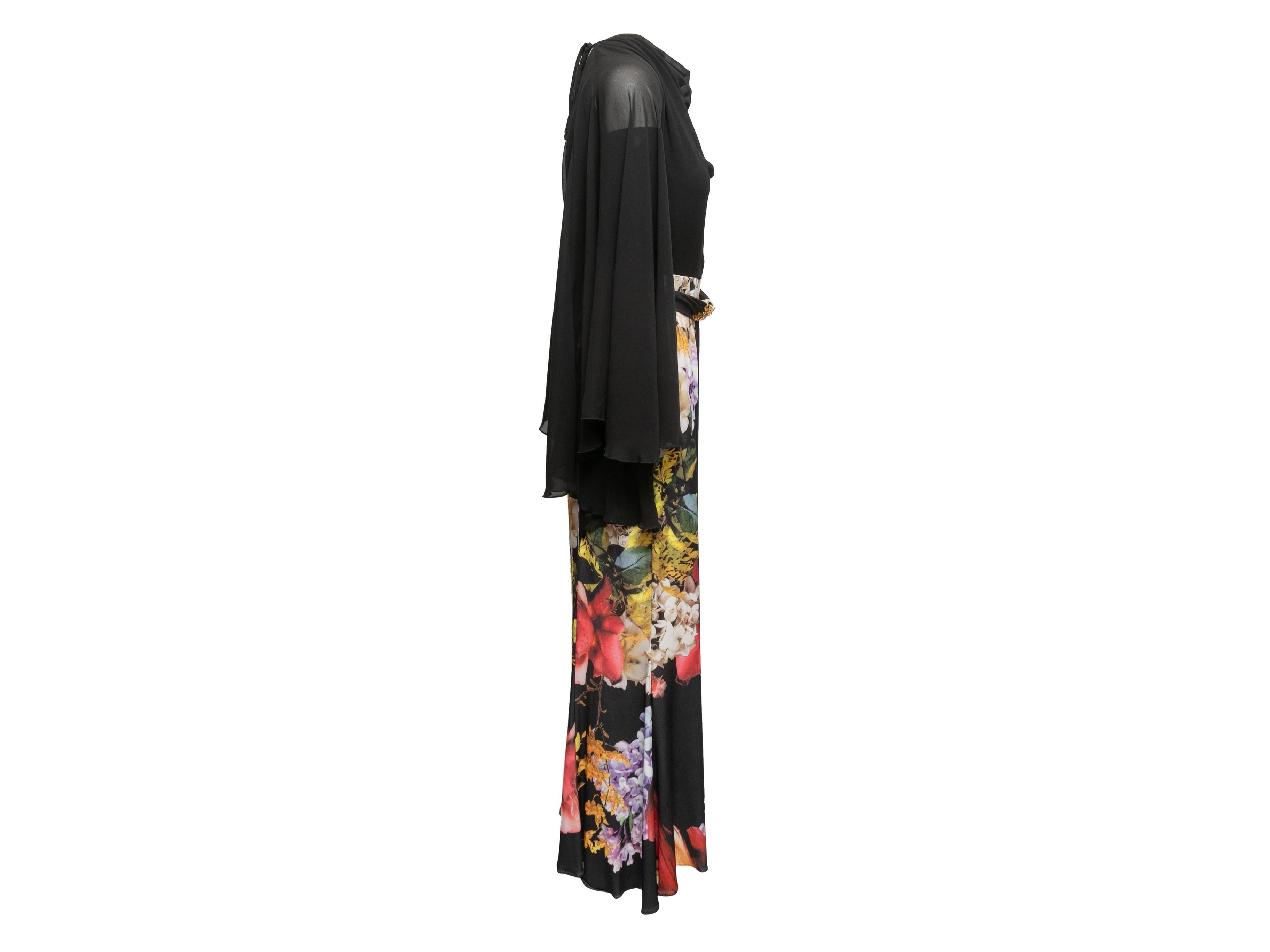 Product Details: Black and multicolor long sleeve floral print maxi dress by Roberto Cavalli. Cowl neckline. Belt at waist. Open back. Zip closure at back. 32