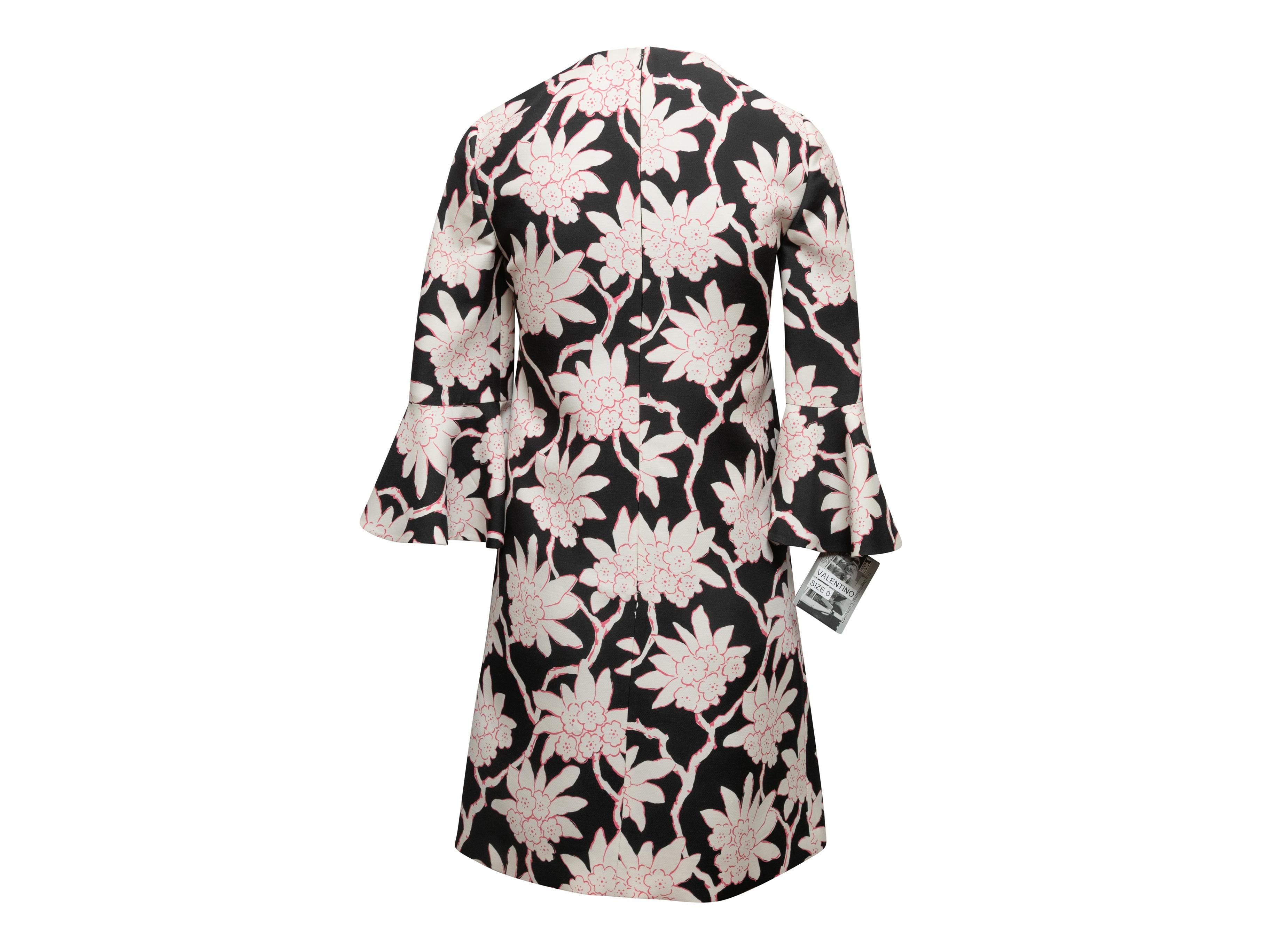 Black, white, and pink wool and silk-blend floral print mini dress by Valentino. Crew neck. Three-quarter sleeves. Zip closure at back. Designer size 00. 32