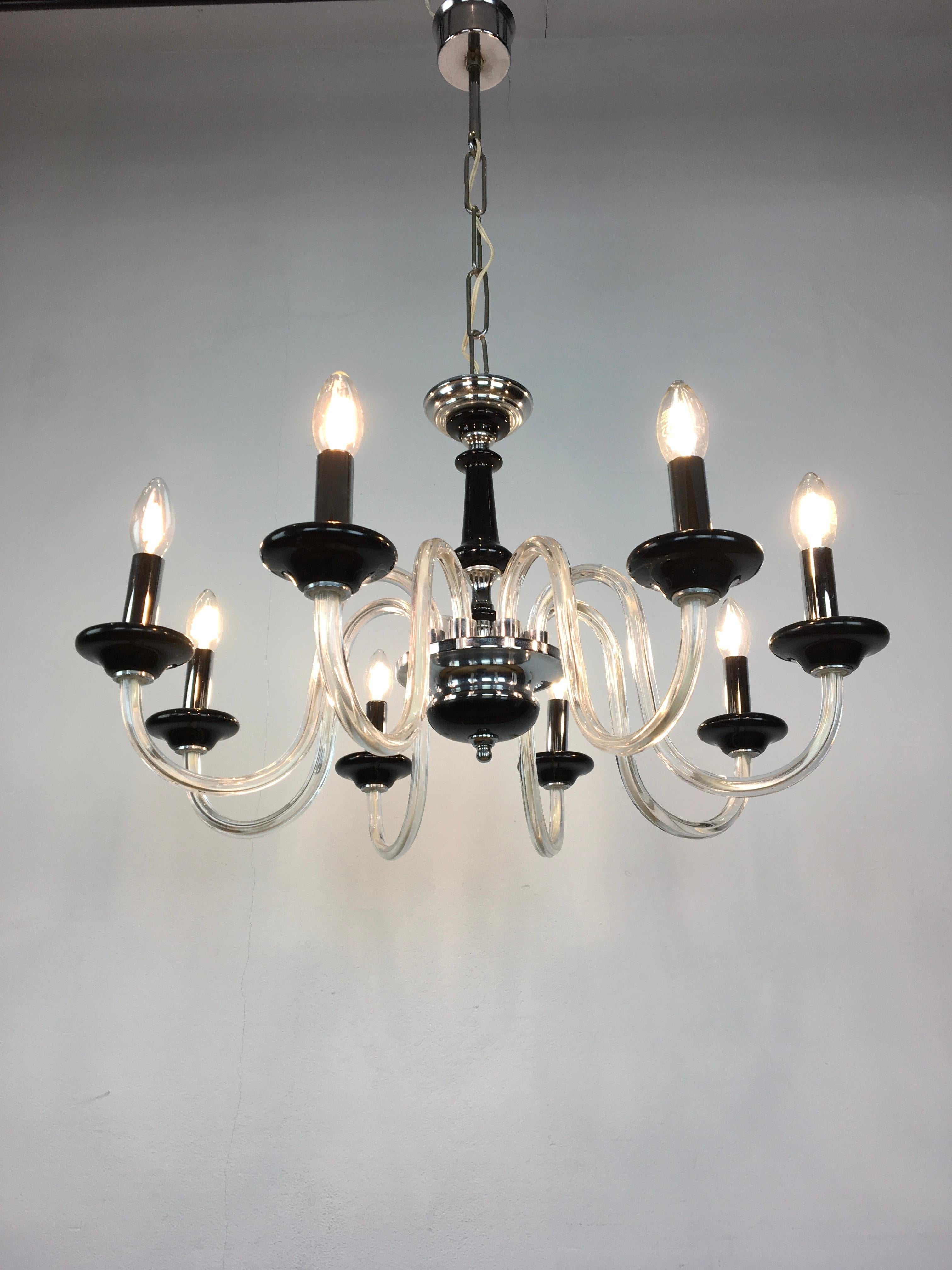 Black 8-armed Murano glass chandelier. 
A Mid-20th Century black ceiling light with 8 curling arms.
A great looking vintage Italian chandelier or ceiling light with black murano glass details and chromed tube covers. 

With chain and suspension