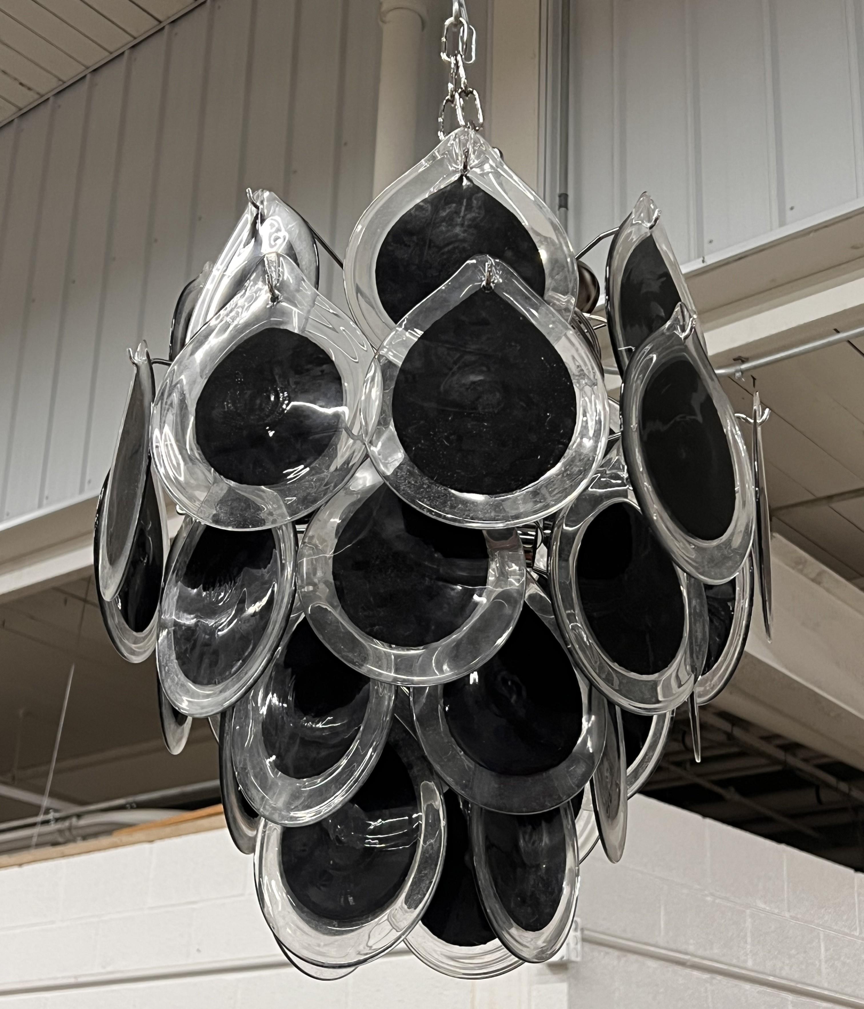 Vistosi Murano Disc Chandelier 
36 vintage black teardrop colored 6-inch discs, new structure, 4 light sockets. 
Total Length including chain is 46