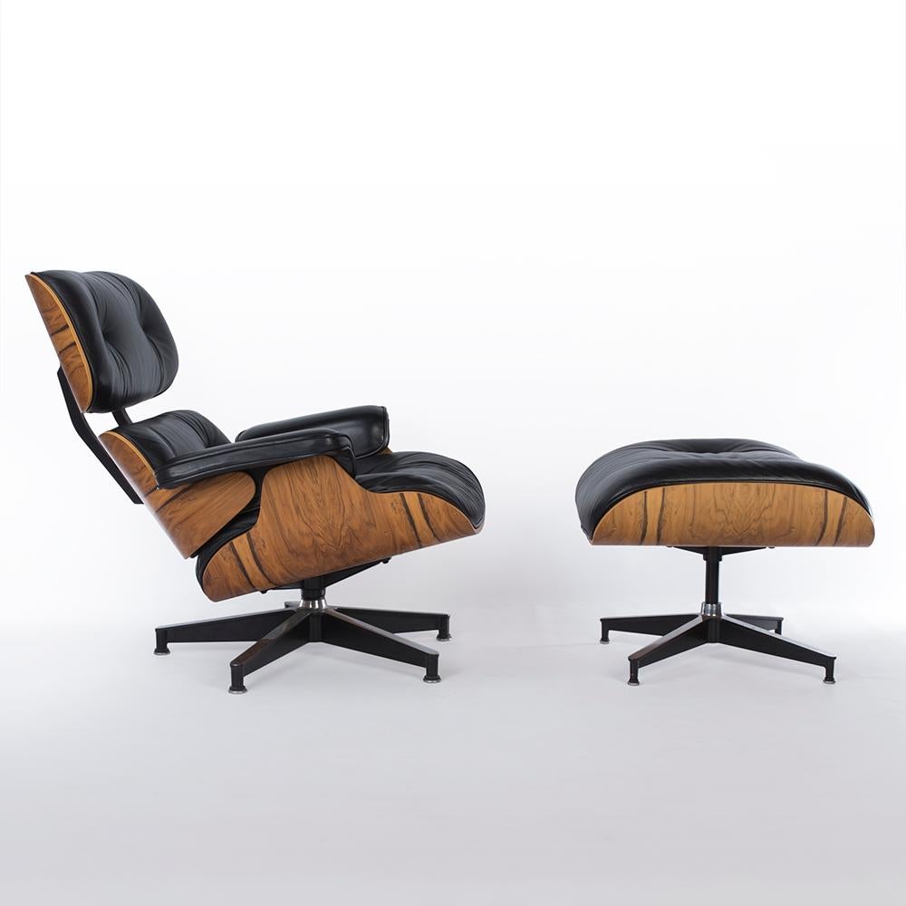 This is an original, used, high-quality Herman Miller Eames lounge chair and ottoman set with beautiful, golden natural Santos veneer wood. Considering its age, it remains in top condition. The height of this is a standard regular, reflecting the