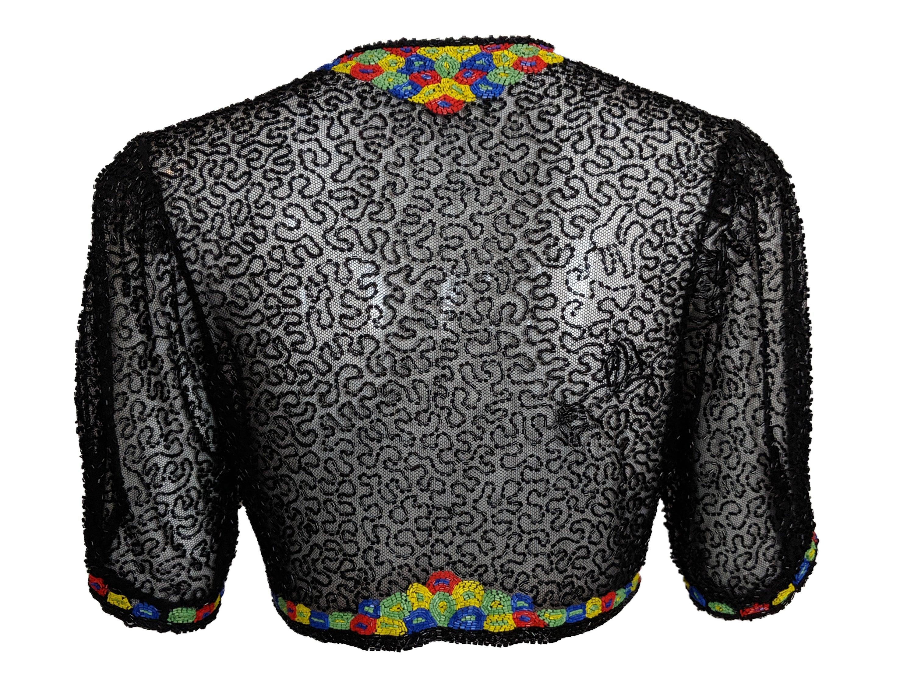 Atemberaubende Abendjacke im Bolero-Stil der 1930er Jahre aus schwarzem Netz mit schwarzen Bügelperlen. Verziert mit mehrfarbigen Perlen in einem Dekomuster. Vorne offen. In ausgezeichnetem Zustand.

Zusätzliche Informationen:
Abmessungen: Büste: