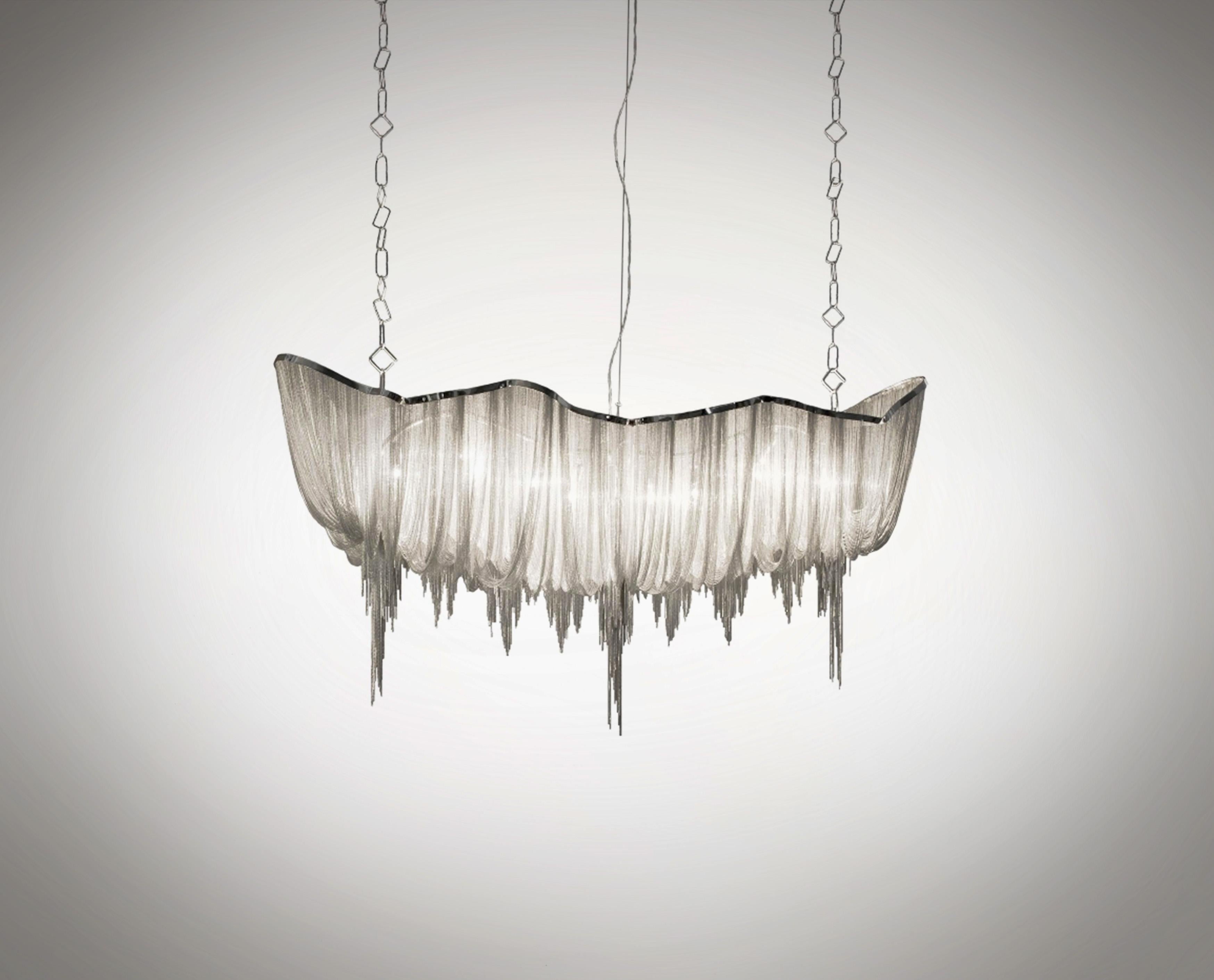 Immerse yourself in the shimmering elegance of the Atlantis chandelier, an iconic design creation by Barlas Baylar for Terzani, Italy. 

A chandelier design so innovative that Mr Karl Lagerfeld himself had to have one. This exquisite luminary is a