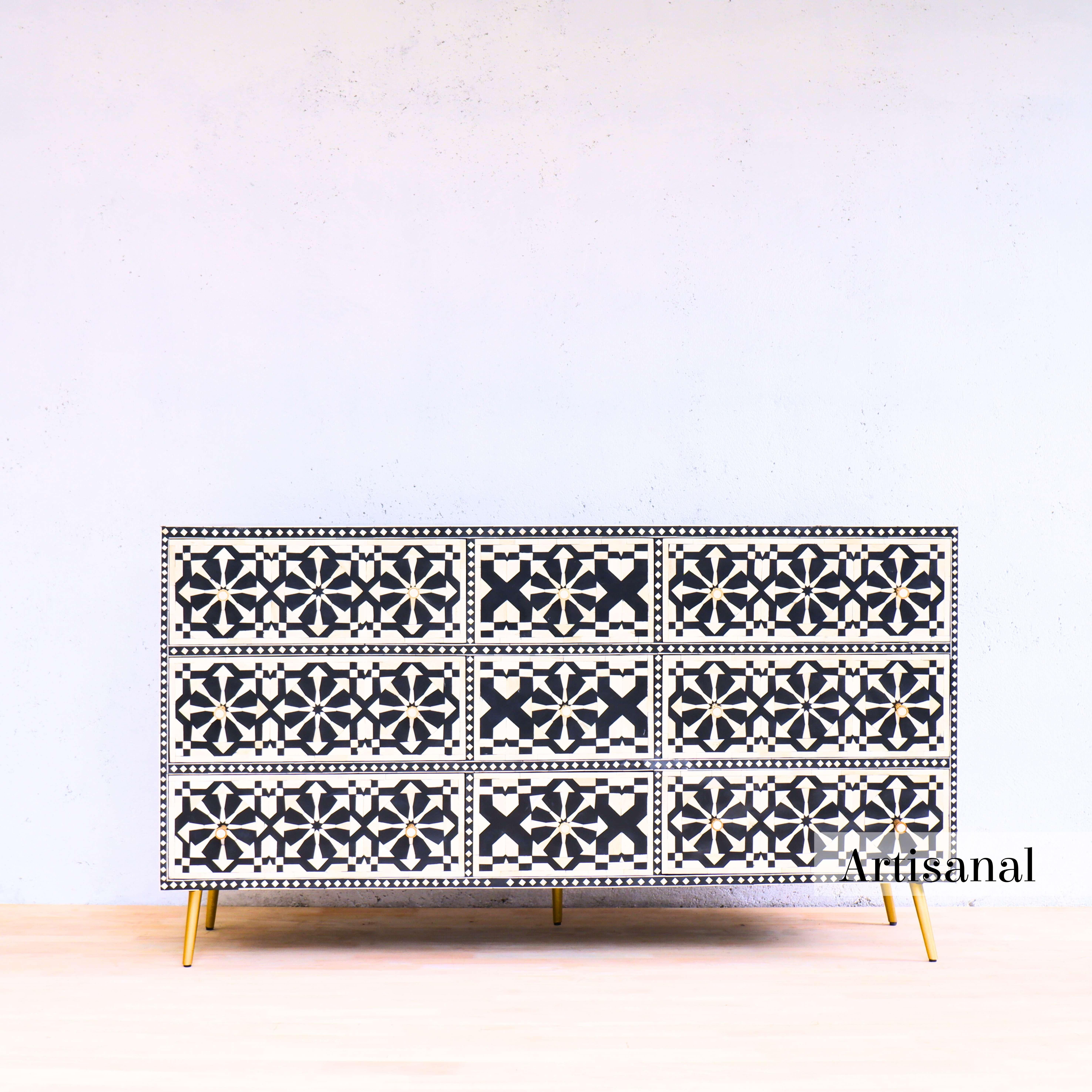 Elevate your home with Artisanal's exquisite black-and-white nine -drawer inlay chest—a stunning addition that seamlessly blends timeless craftsmanship with modern sophistication.

Adorned with intricate moroccan zellige patterns, this dresser