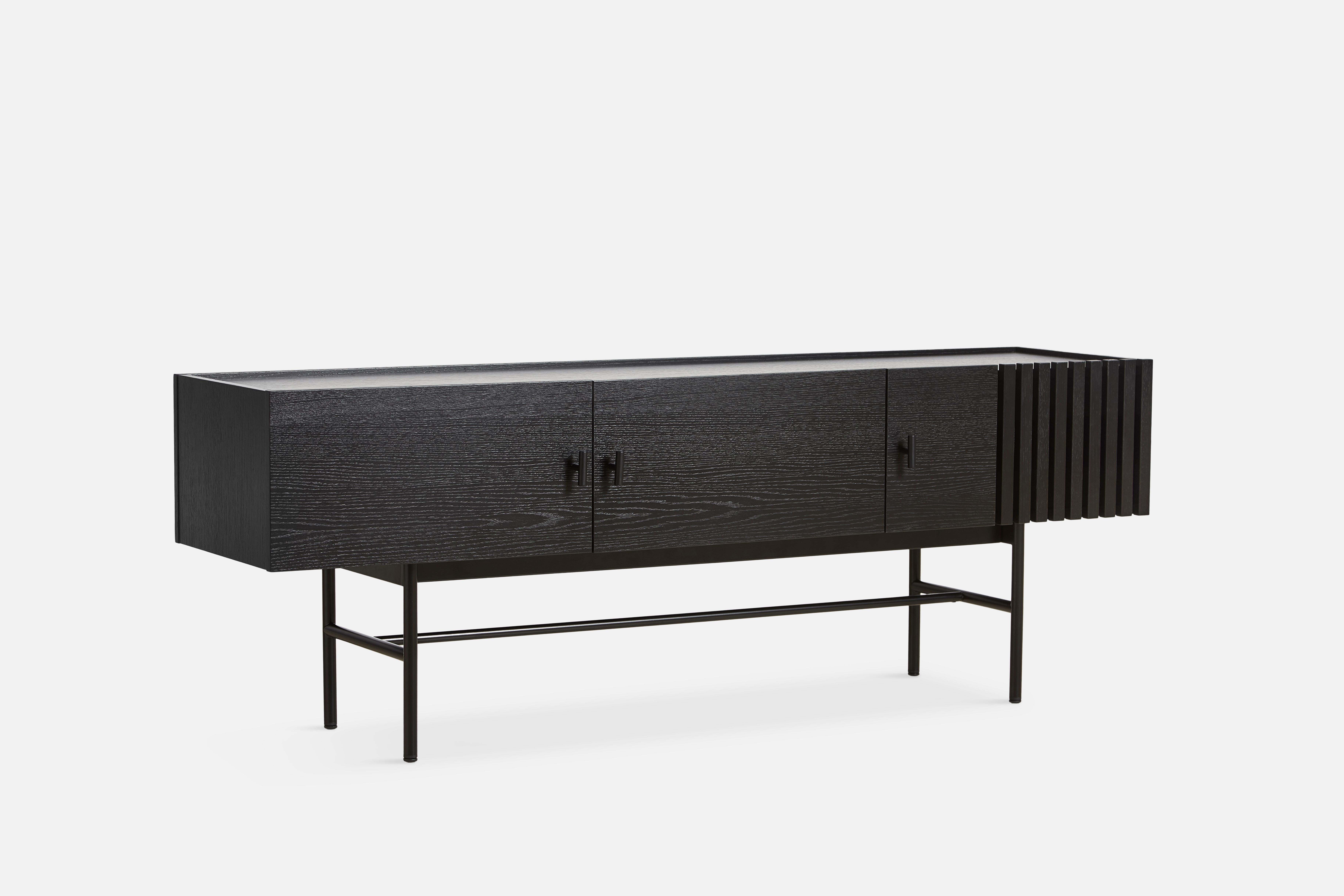 Black oak array low sideboard 150 by Says Who
Materials: Oak, Metal
Dimensions: D 37 x W 150 x H 53 cm
Also available in different colours and materials.

The founders, Mia and Torben Koed, decided to put their 30 years of experience into a new