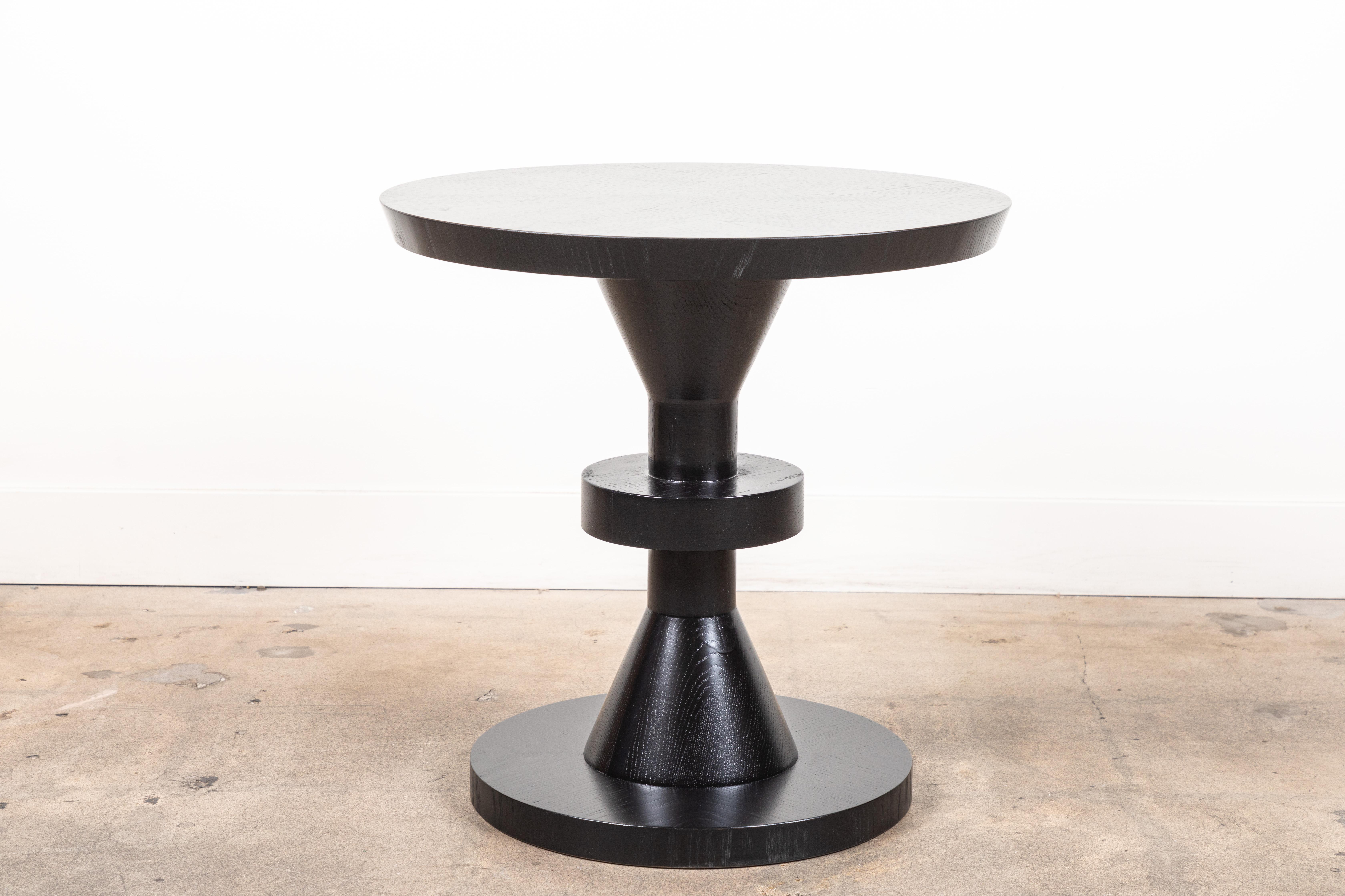 The capitola table features a series of geometric shapes stacked on top of each other with solid wood details. Available in American walnut or white oak. Shown here in ebonized oak.

The Lawson-Fenning collection is designed and handmade in Los