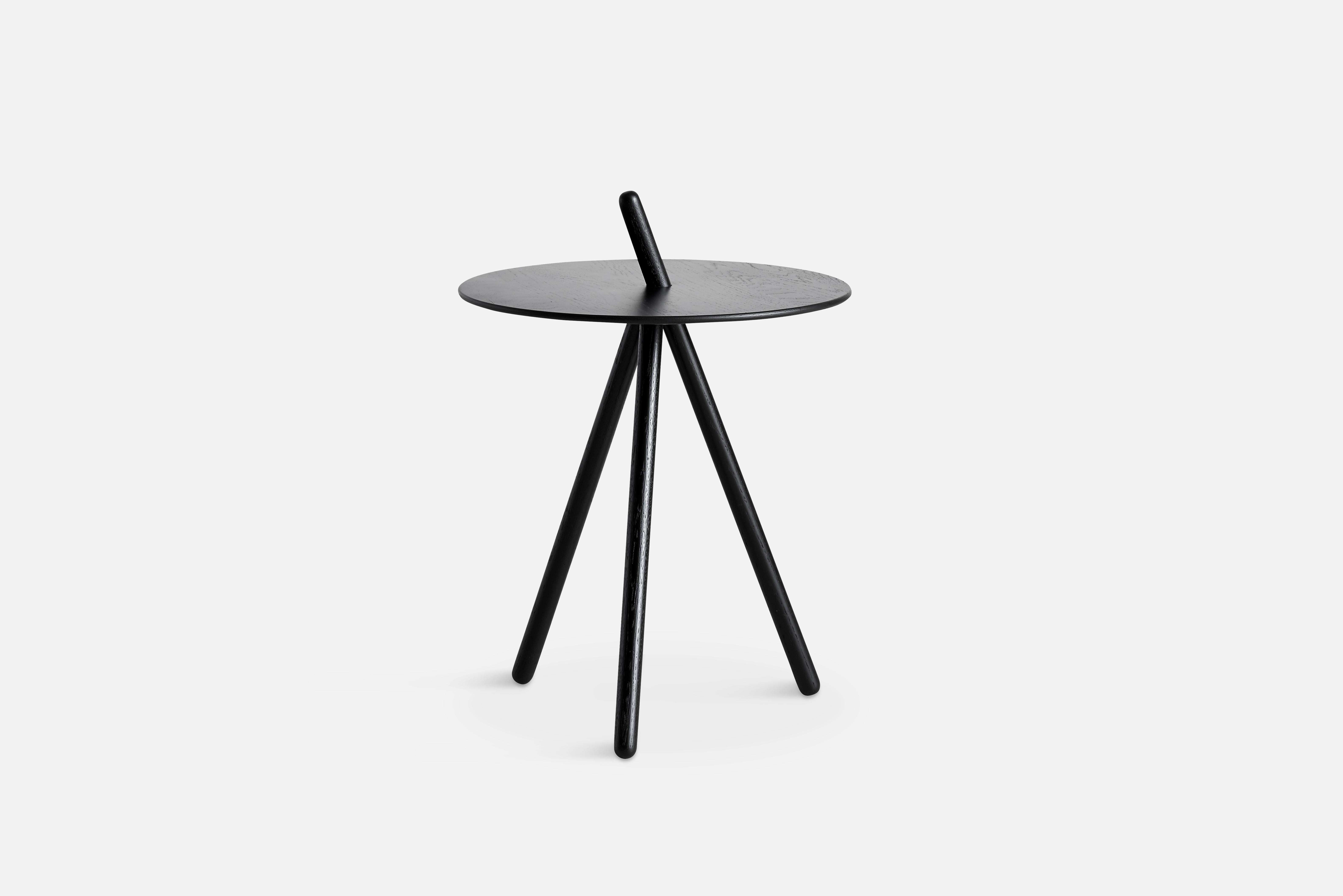 Black oak come here side table by Steffen Juul
Materials: Oak.
Dimensions: D 41 x W 41 x H 45 cm.

The founders, Mia and Torben Koed, decided to put their 30 years of experience into a new project. It was time for a change and a new challenge.