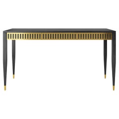 Black oak desk with three drawers with brass fronts in mid century modern style