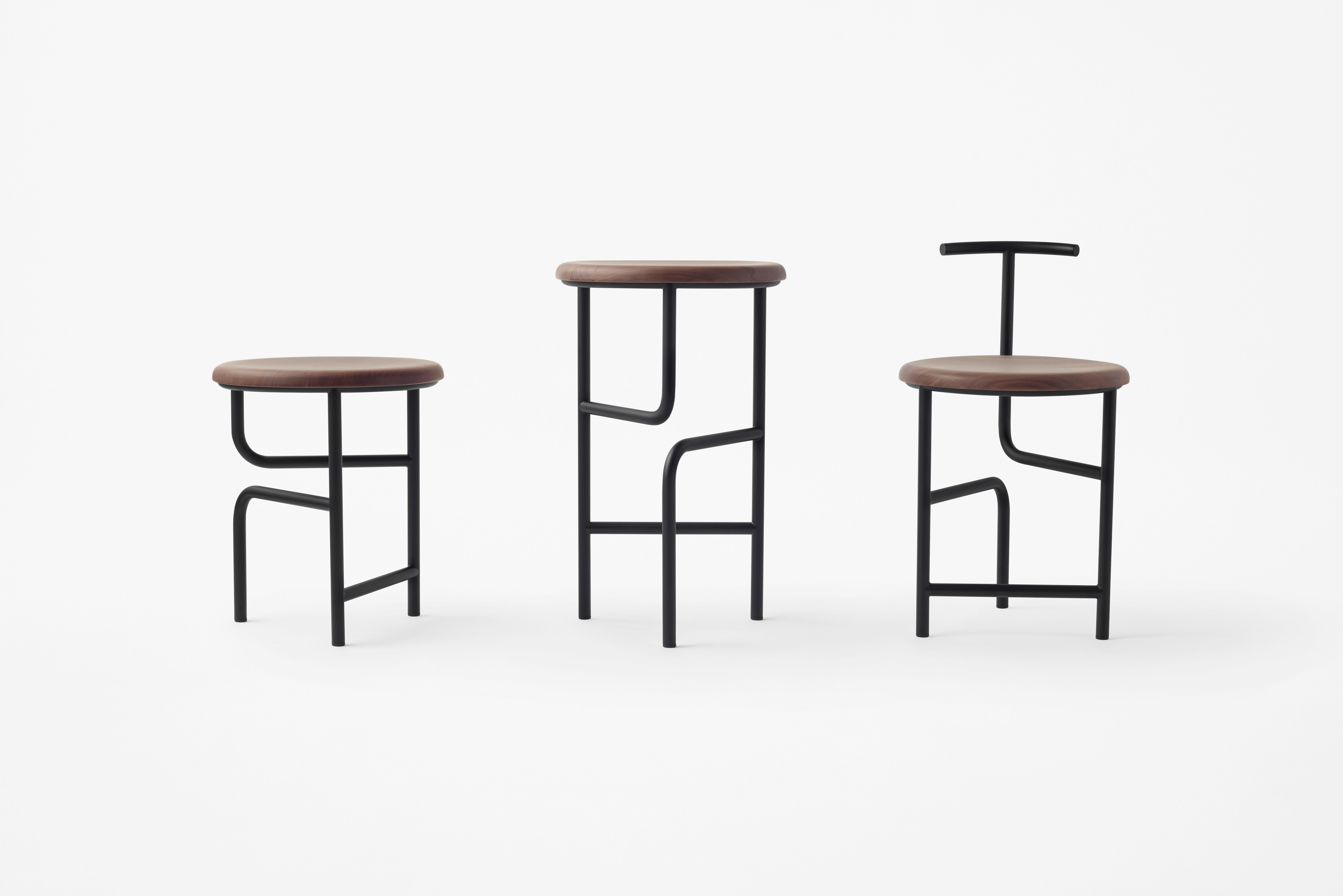The blend stool from Stellar Works puts its curling form to work, showcasing a three-legged ensemble that appears to fold out from a parallel base. An open, visually lighter frame is counterpointed with the robust materials used to help it stand. It