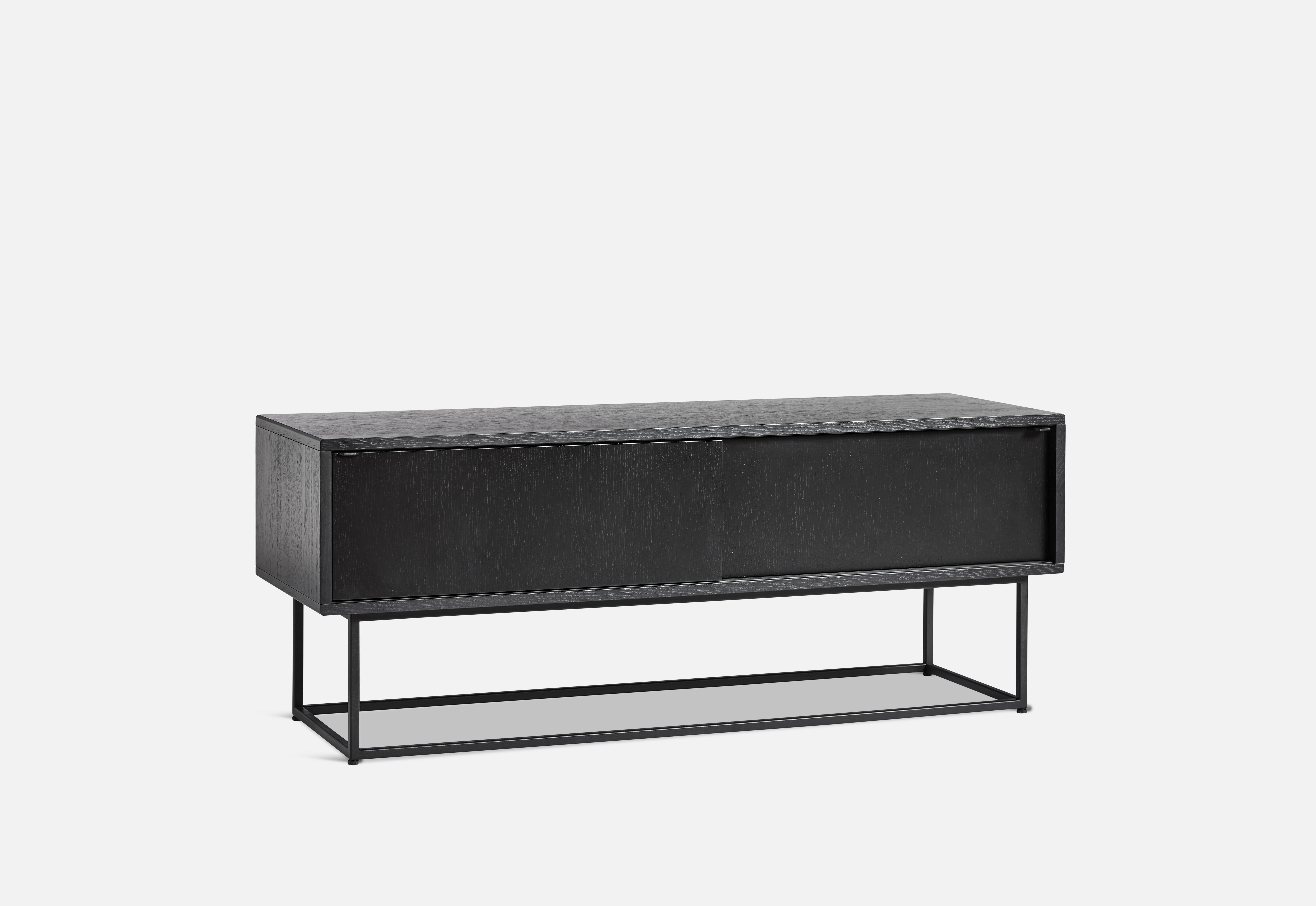 Black oak virka low sideboard by Ropke Design and Moaak
Materials: Oak, metal.
Dimensions: D 40 x W 120 x H 47 cm
Also available in different colours and materials.

The founders, Mia and Torben Koed, decided to put their 30 years of experience
