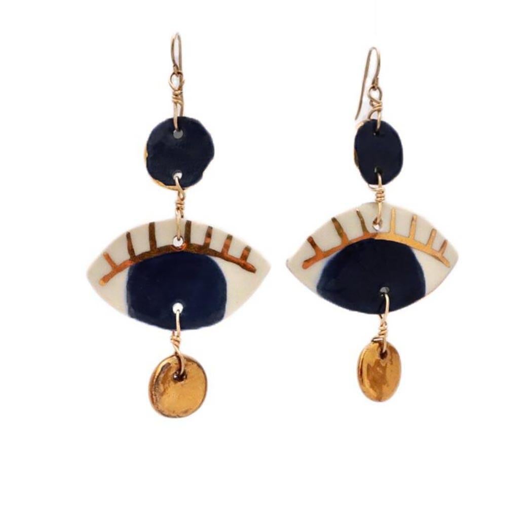 Handcrafted earrings in porcelain, painted in our deep and custom made deep black glaze and with 14k gold leaf detail. Hypoallergenic gold-filled ear wire.  Each piece is hand made so slightly different from each other which gives our jewelry its