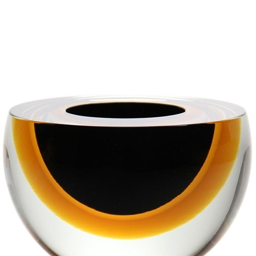 Bowl Black Ocher Flat in mouth blown glass
in clear glass, amber glass and dark smocked 
glass finish.


 
