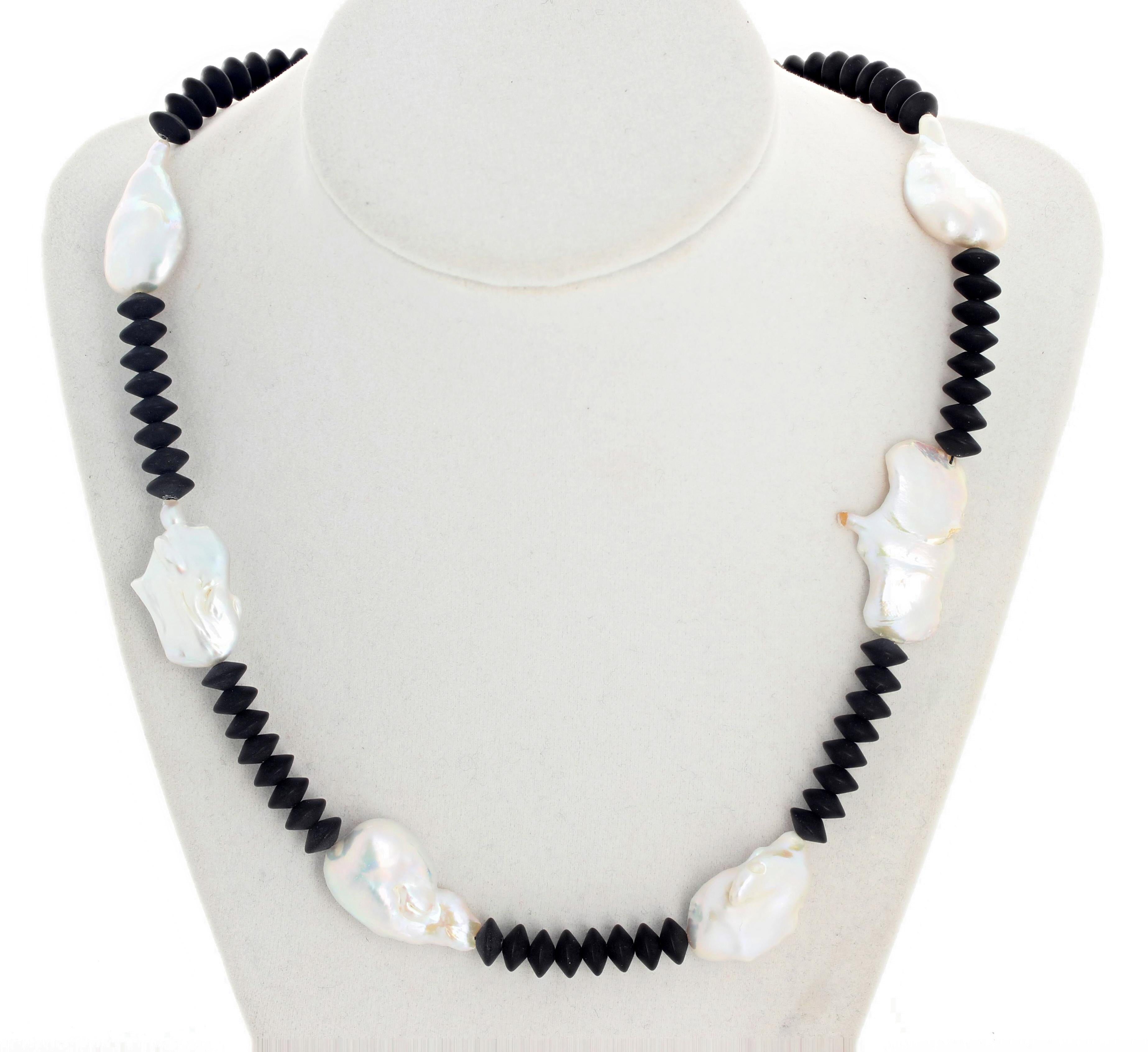 20 inch long super-elegant unique black Onyx rondels and natural Cultured Pearls necklace with a matching easy to use silver plated pearl hook clasp.   If you wish faster delivery on your purchase choose UPS to ship for you.  