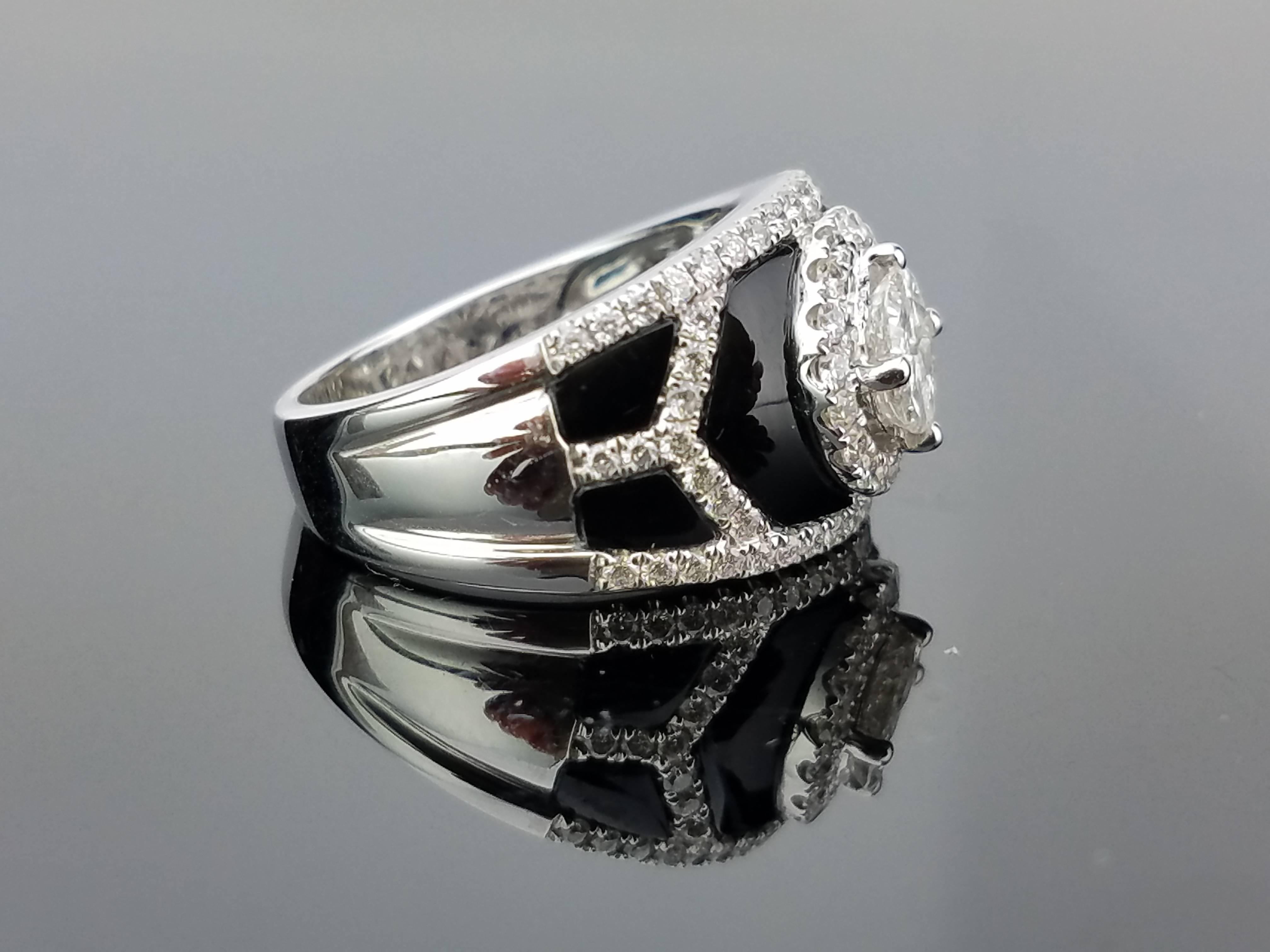 A unique, art-deco looking black onyx and diamond cocktail ring, where the centre stone looks like a single diamond stone but is actually 4 stones (viva diamonds) set together. The cutting and setting of the stone make it look like a brilliant cut