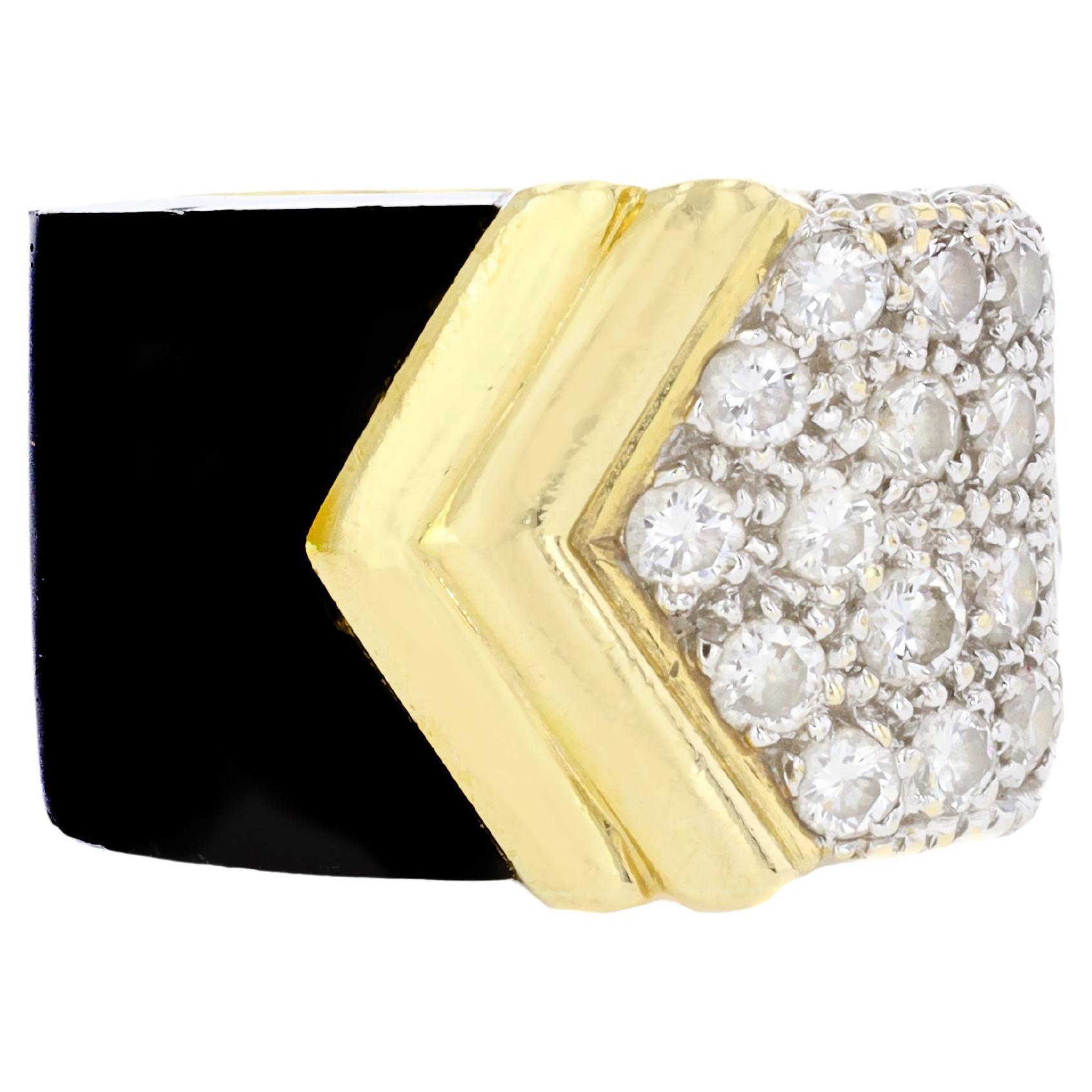 18K yellow gold and black onyx ladies ring containing 20 round diamonds weighing approximatey 1.00 ctw.