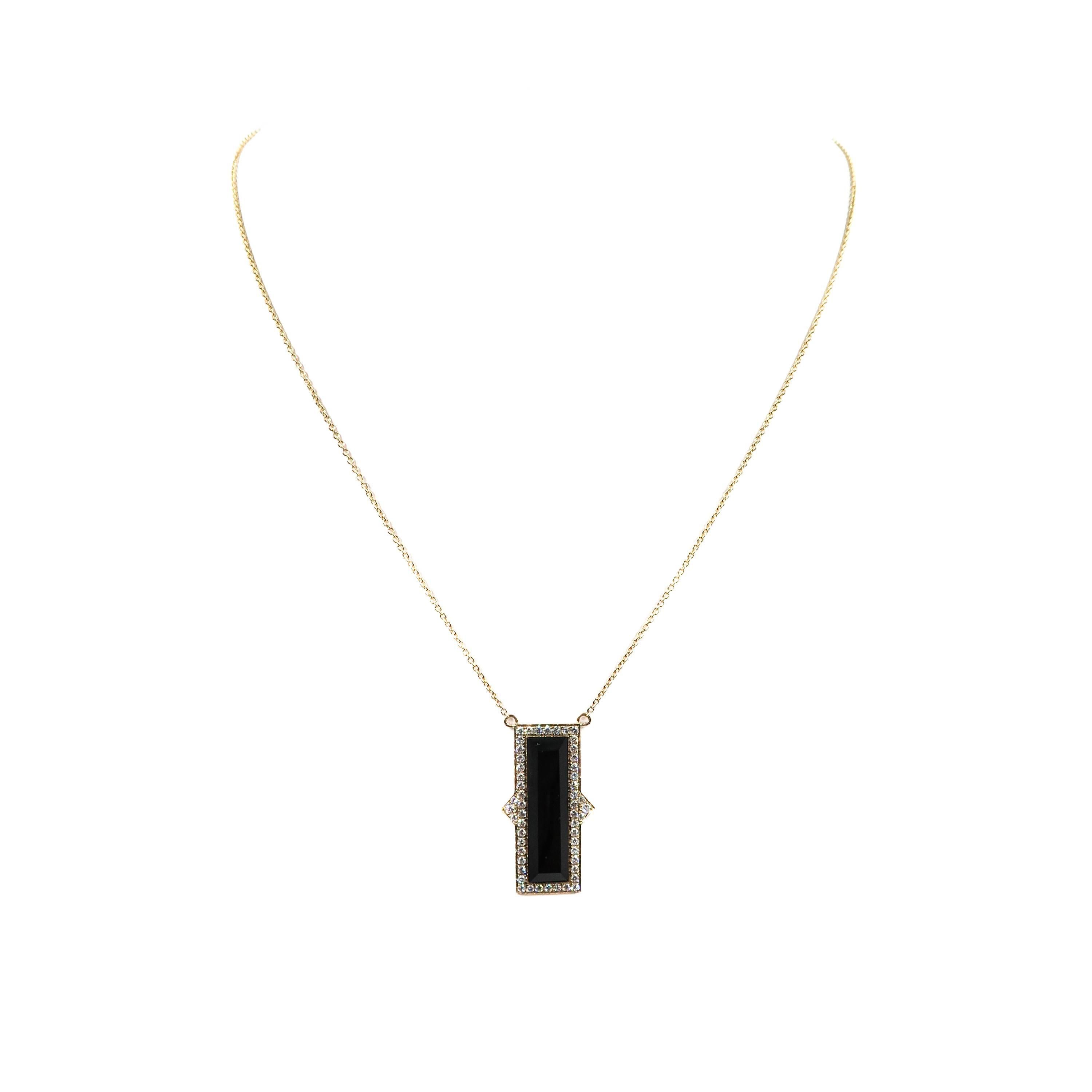 This incredible Black Onyx and Diamond Pendant is an eye catching and sleek design, a winning combination of black onyx, diamond and gold. 
Handcrafted in 18k yellow gold, black onyx and adorned with white round brilliant cut diamonds, designed by