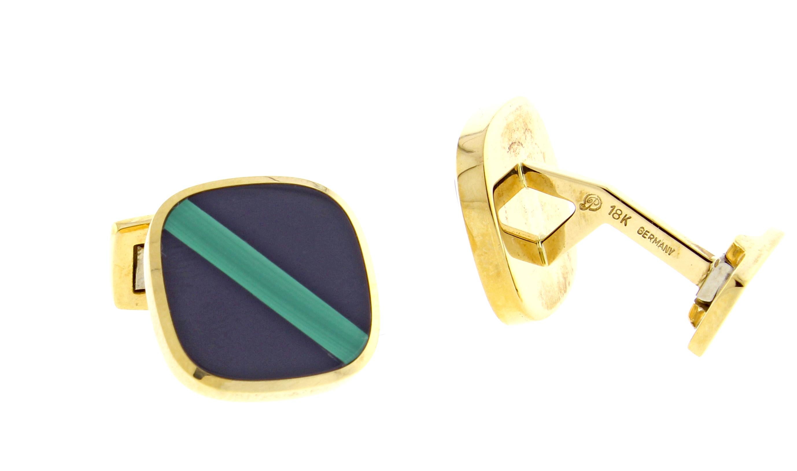 From Pampillonia jewelers, a pair of black onyx and malachite 18 karat gold cufflinks. The wing back cufflinks feature a stripe of malachite with two sections of black onyx on are meticulously crafted in Germany for Pampillonia jewelers. 17mm square