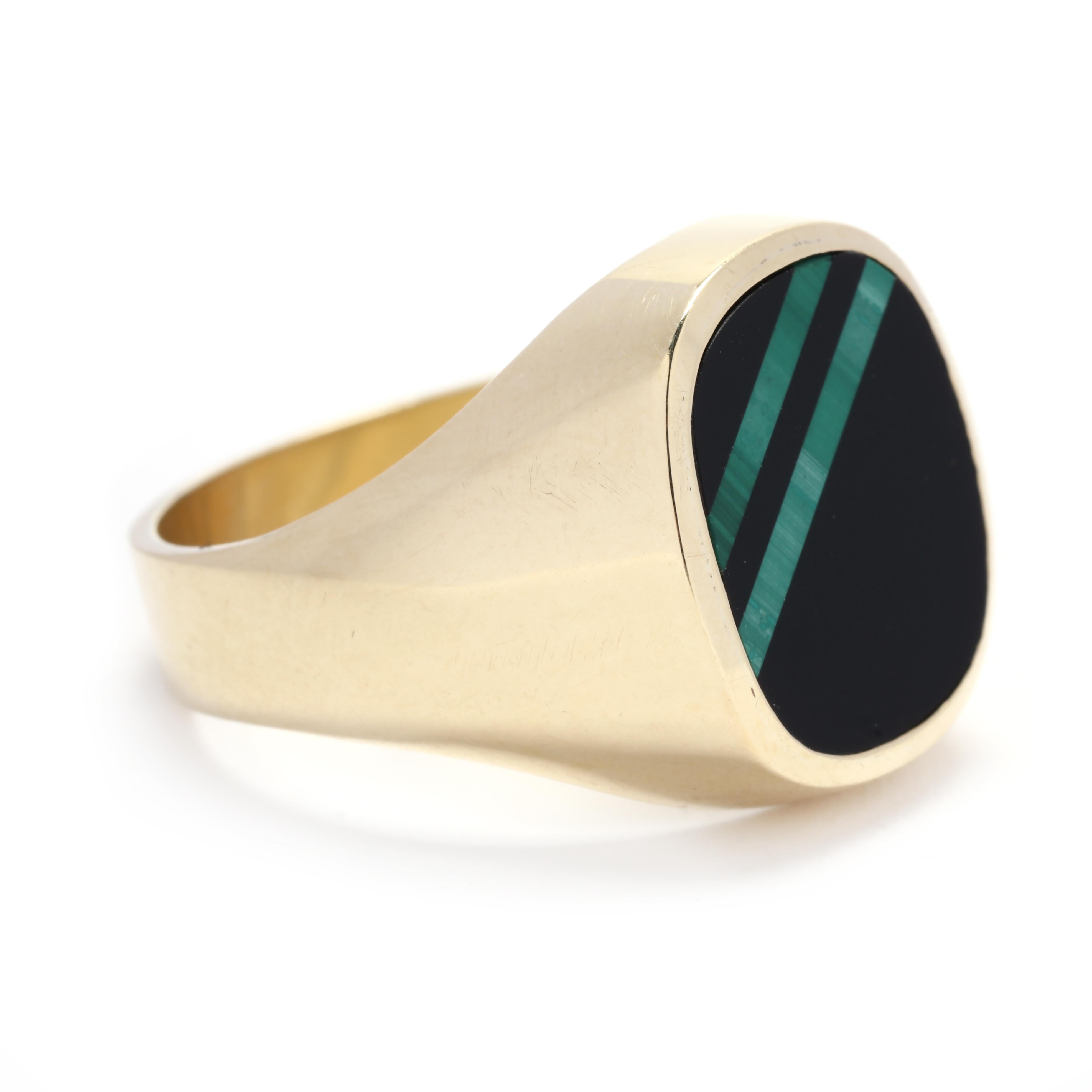 Featuring a large black onyx stone and a smaller malachite stone, this ring showcases a beautiful contrast of colors and textures. The black onyx is sleek and modern, while the malachite offers a vibrant pop of green. Together, they create a