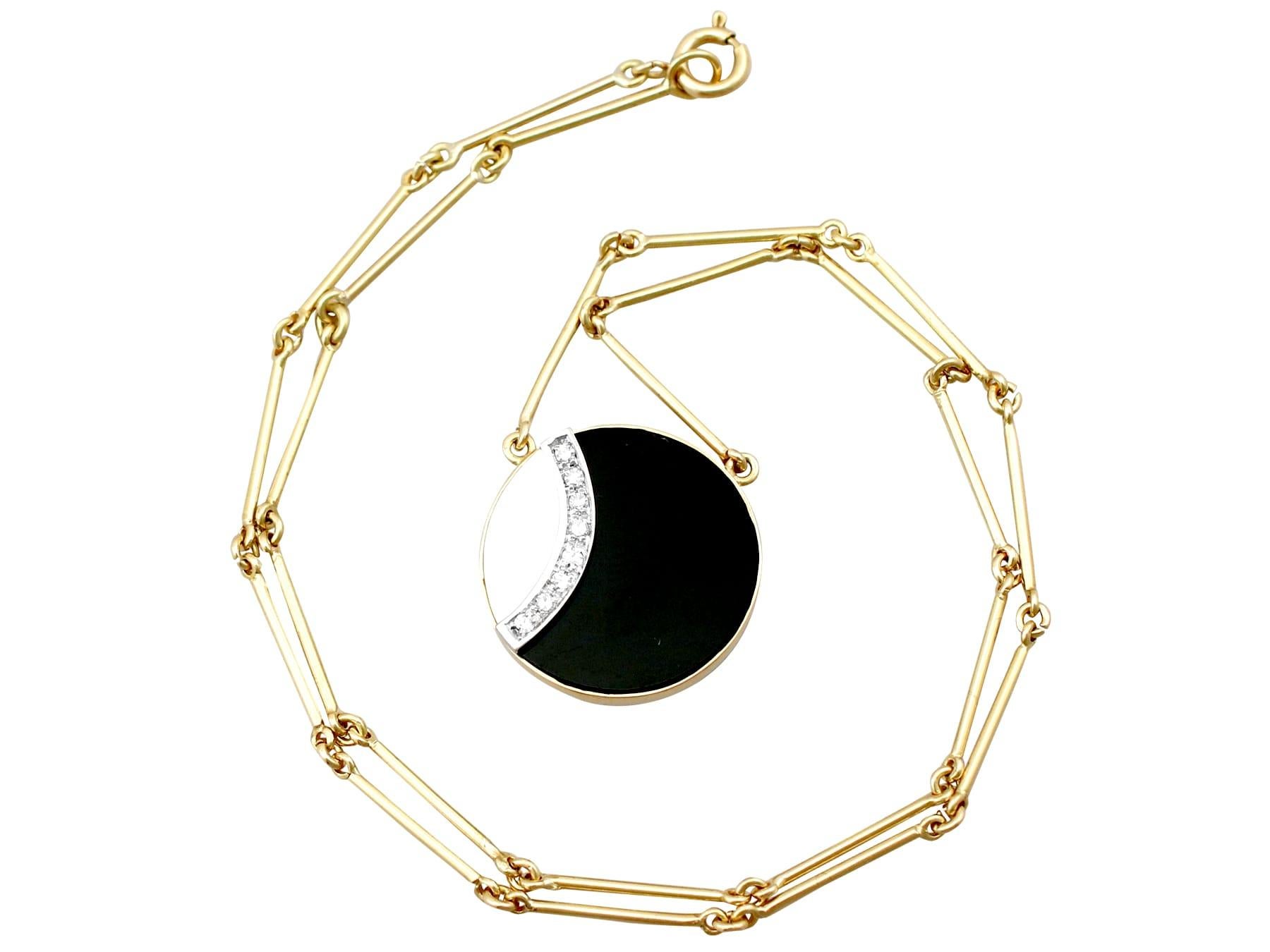 An impressive vintage black onyx and mother of pearl, 0.22 carat diamond and 18k yellow and white gold necklace; part of our diverse gemstone jewelry and estate jewelry collections.

This fine and impressive vintage pendant has been crafted in 18k