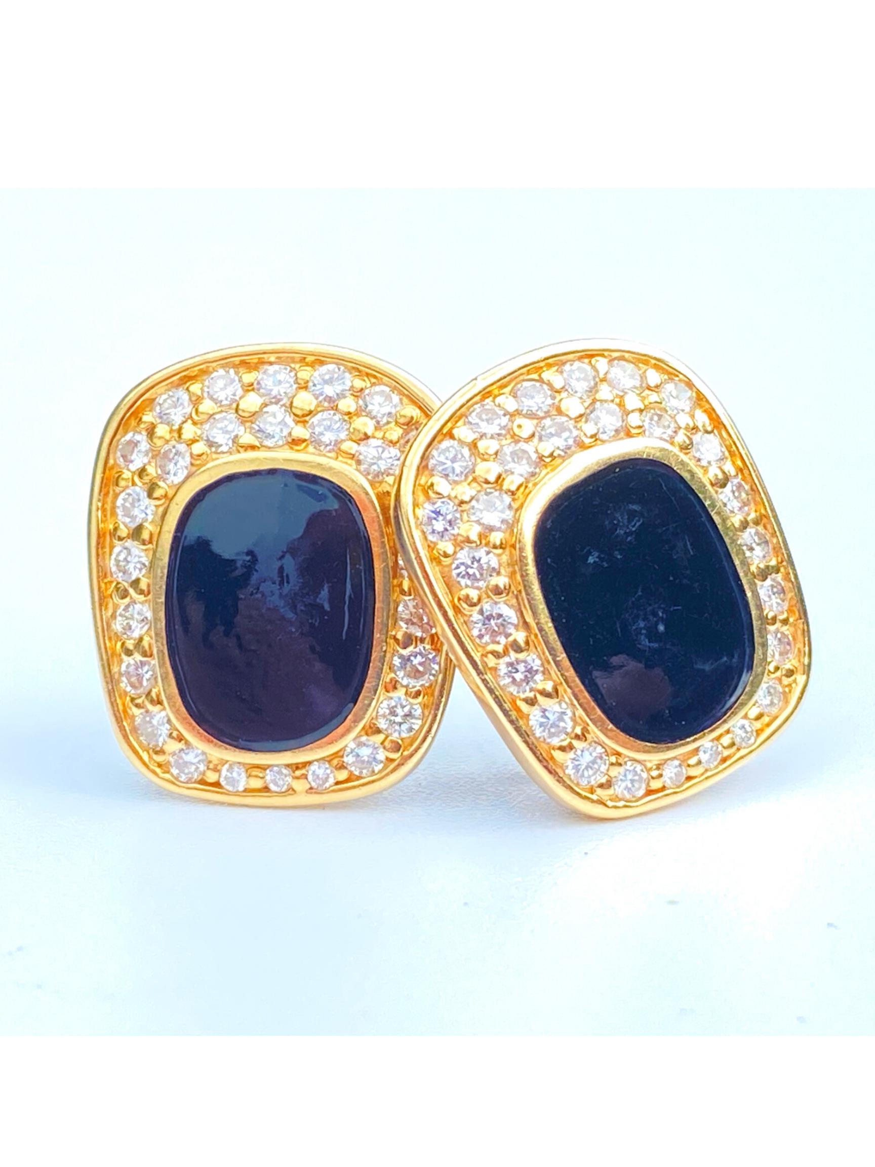 Centering lovely Oval-Cut Black Onyx, framed by 53 Round-Brilliant Cut Diamonds, and set in 14.4 grams of 14K Yellow Gold.

Details:
✔ Stone: Black Onyx
✔ Stone Cut: Oval
✔ Stone Color: Black
✔ Earrings: 14K, 53 Round-Brilliant Cut Diamonds
✔ Era: