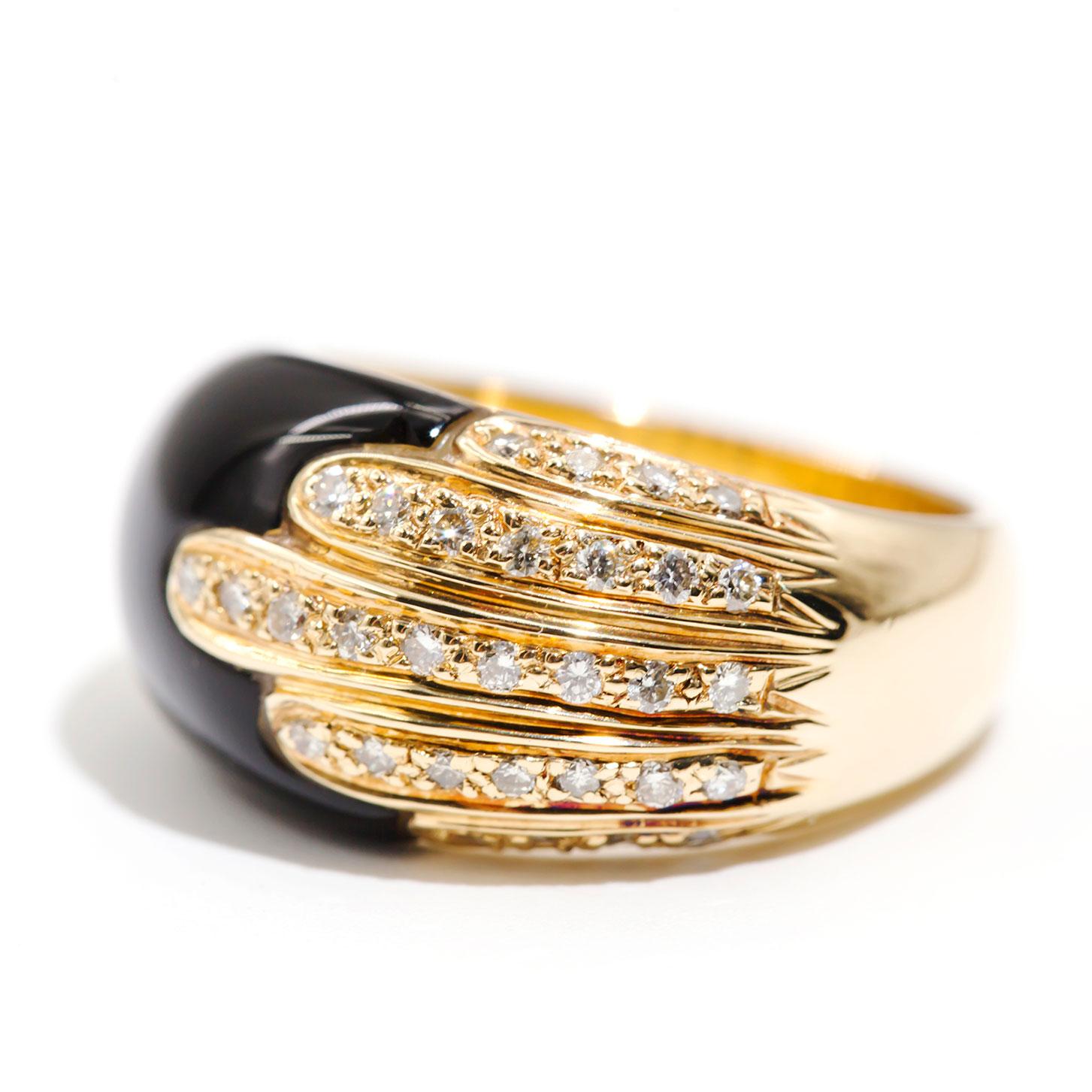 Carefully crafted in 18 carat yellow gold is this gorgeous Art Deco inspired onyx and diamond dome ring. The contrast of the black onyx and the sparkle of the round white diamonds is pure opulence. We have named this unforgettable Art Deco inspired