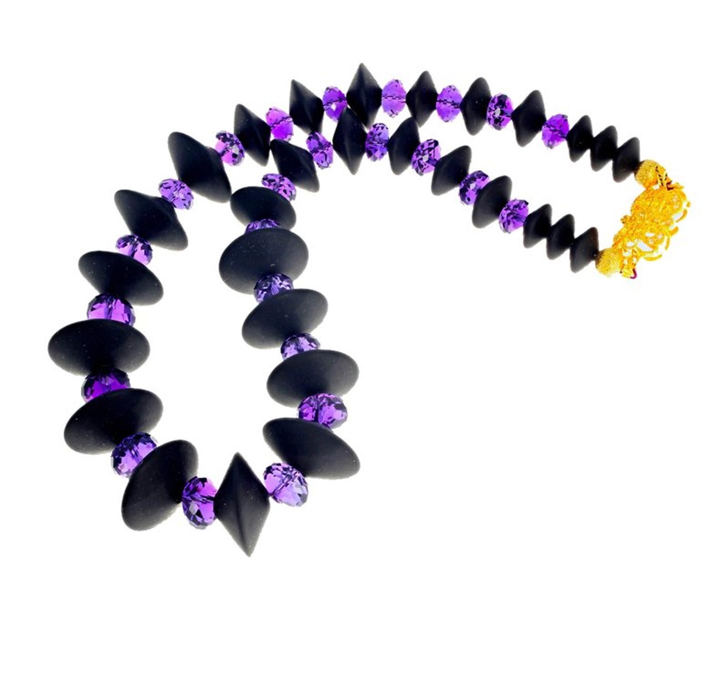 Large checkerboard gem cut glittering Amethyst rondel gemstones enhanced by these lovely round black Onyx gems in a 15 inch necklace with gold washed clasp. The largest Onyx are 20 mm.  This is magnificently sparkling and glamorous around your neck.