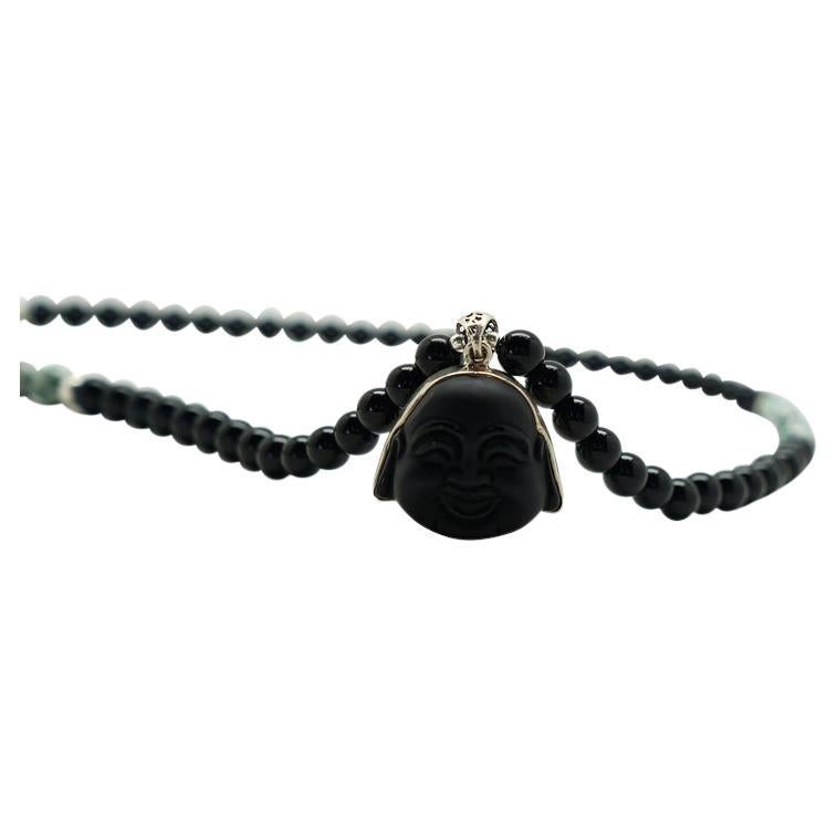 Story Behind The Jewelry
Our unisex Tree of Life necklace is adored with a Black Onyx Buddha set in sterlins silver on a gemstone chain laced with Tree Agate and Black Onyx. The necklace represents finding peace in the circle of life. Tree agate is