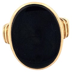 Anello antico in oro giallo 14k con onice nero e spalle a coste