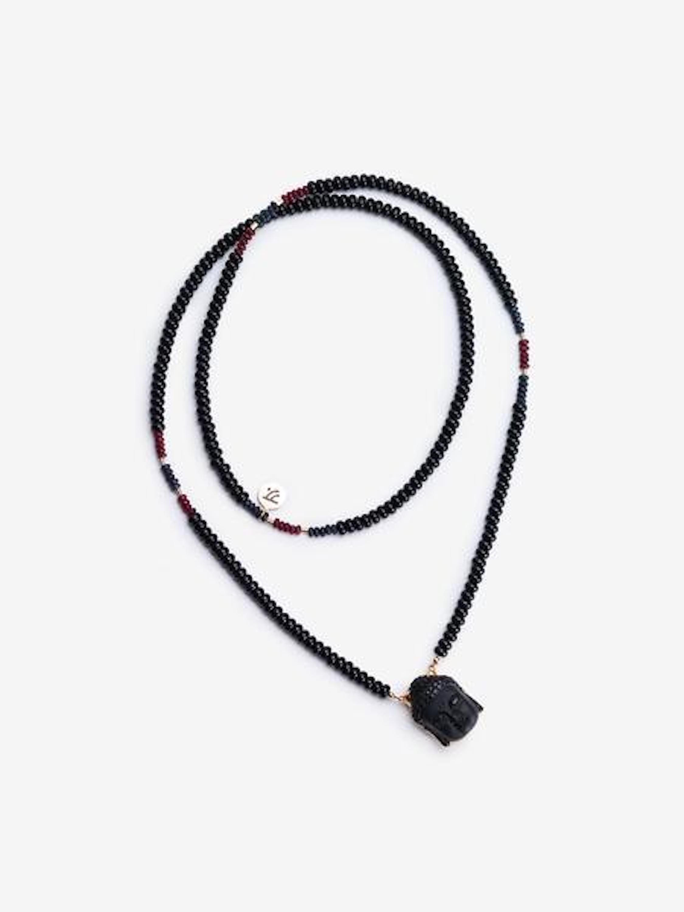 Onyx is a perfect stone to protect you and also gives you courage to move on. The obsidian buddha pendant represent peace-of-mind and enlightenment. The combination of the stones is perfect to overcome loss and move forward.

Materials
Onyx, Black