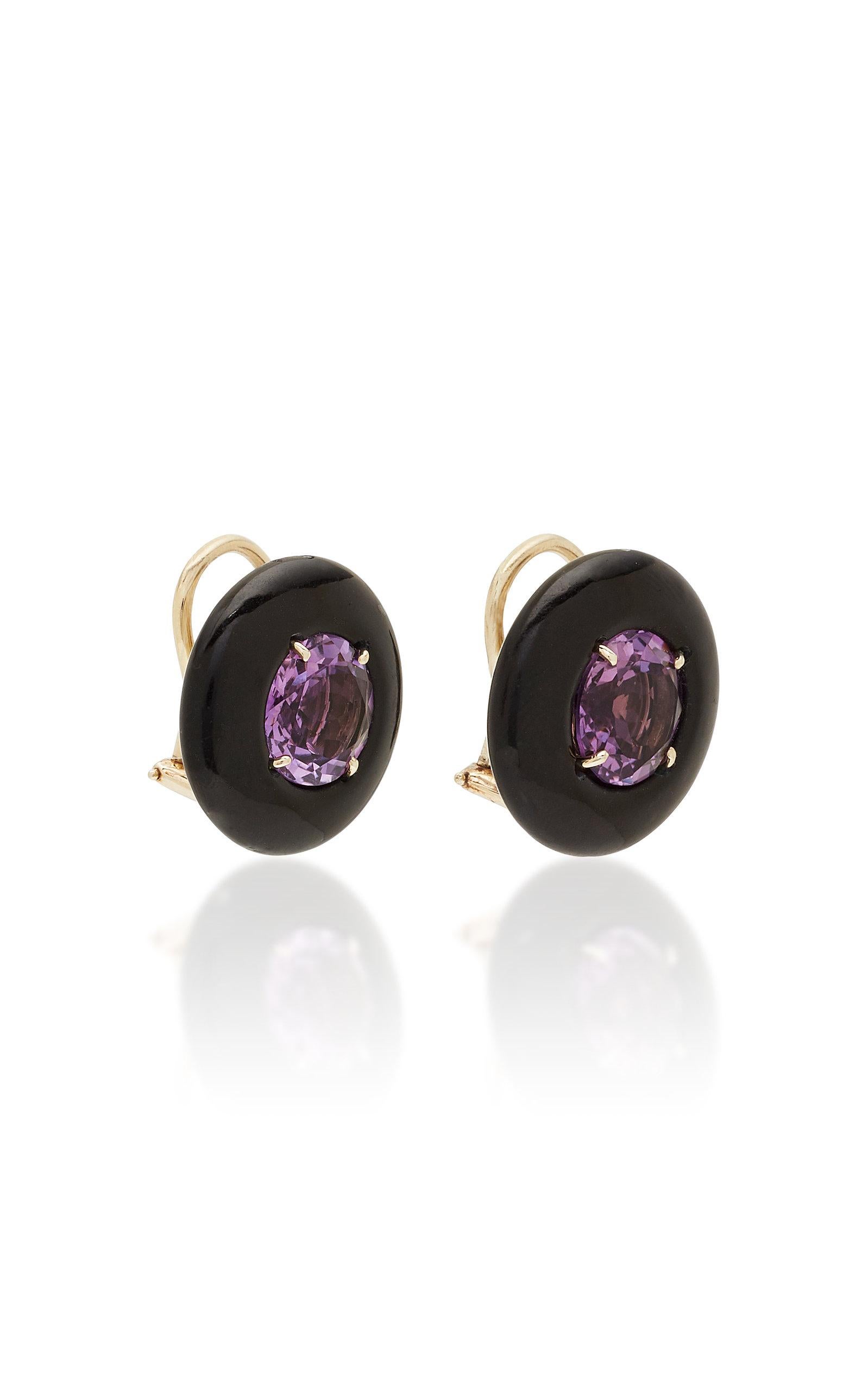 A pair of 20mm rounded black Onyx button clip-on Earrings with a faceted round Amethyst center. Set in 18 karat white gold , signed Sorab & Roshi.
Am=6.75 cts.

3/4