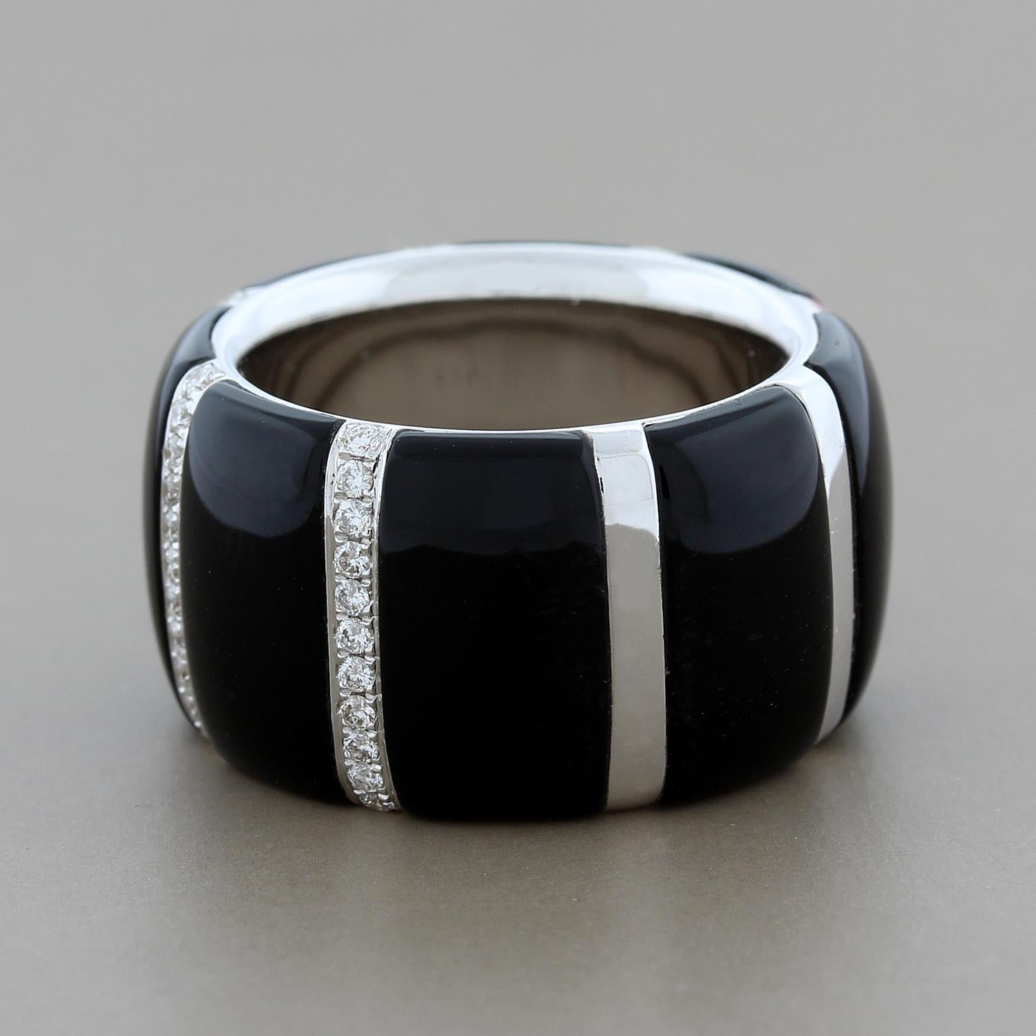 This stunningly chic band features smooth black onyx segmented by 0.43 carats of white round cut diamonds set in 18K white gold. This piece can easily be worn any time of day.  

Currently ring size 6.50
Band Width: 0.50 inches