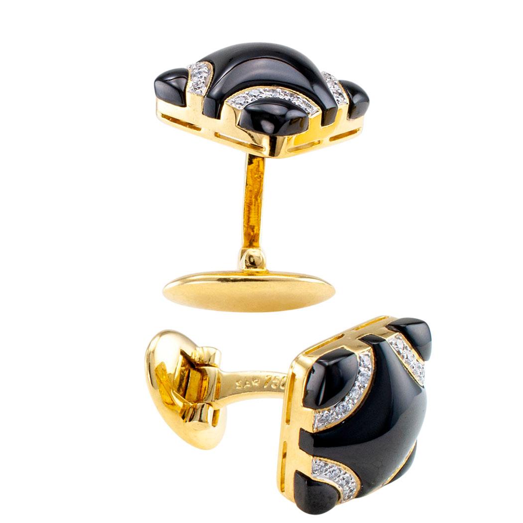 Estate diamond and black onyx gold cufflinks circa 1990. The matching, quadrangular designs are inlaid with black onyx the corners traversed by arched courses set with round brilliant-cut diamonds totaling approximately 0.25 carat, approximately H