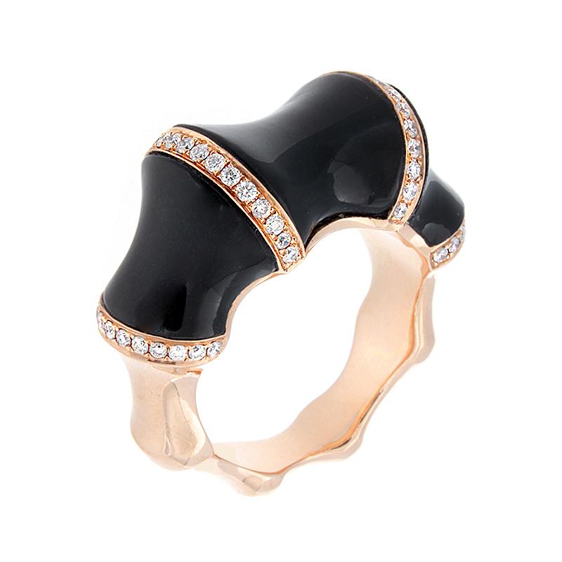 This modern ring set in 18K rose gold features smooth black onyx with 0.38 carats of round cut pave set diamonds. It’s uniquely concave indents give this fun ring a bamboo feel.  

Currently ring size 6.75