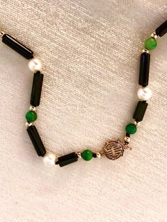 Black onyx, green jade and 14kt gold necklace
