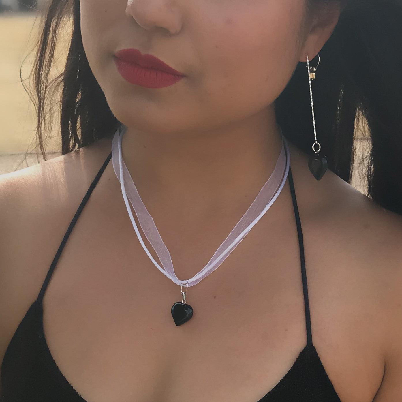 Elevate your style with nlanlaVictory's unique twist on a classic necklace. Our black onyx on white organza ribbon necklace is the perfect statement piece to add to your collection. The organza ribbon necklaces have become a signature element of