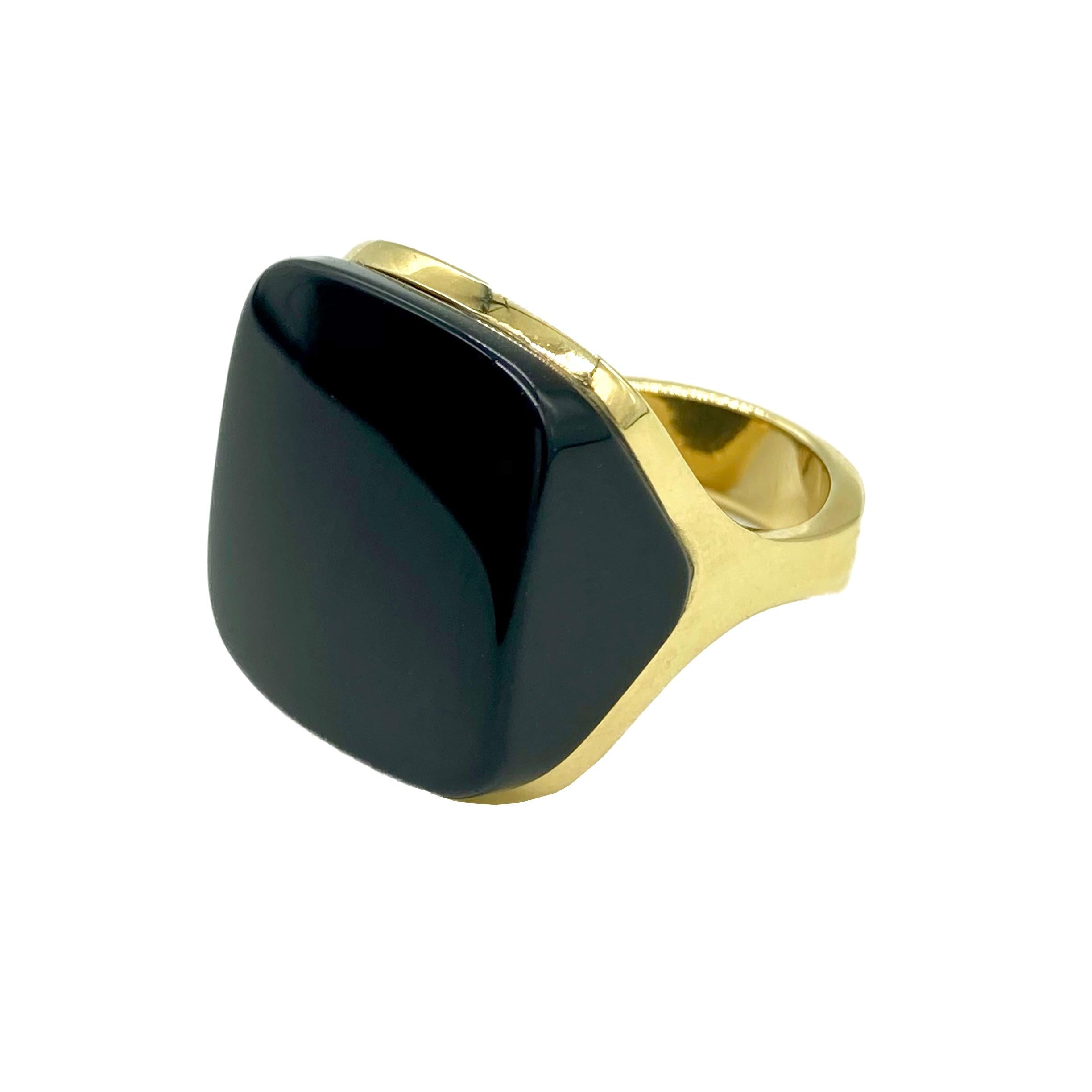 A stylish square-shaped ring in 18 karat yellow gold with black onyx. Made in the USA, circa 1970.