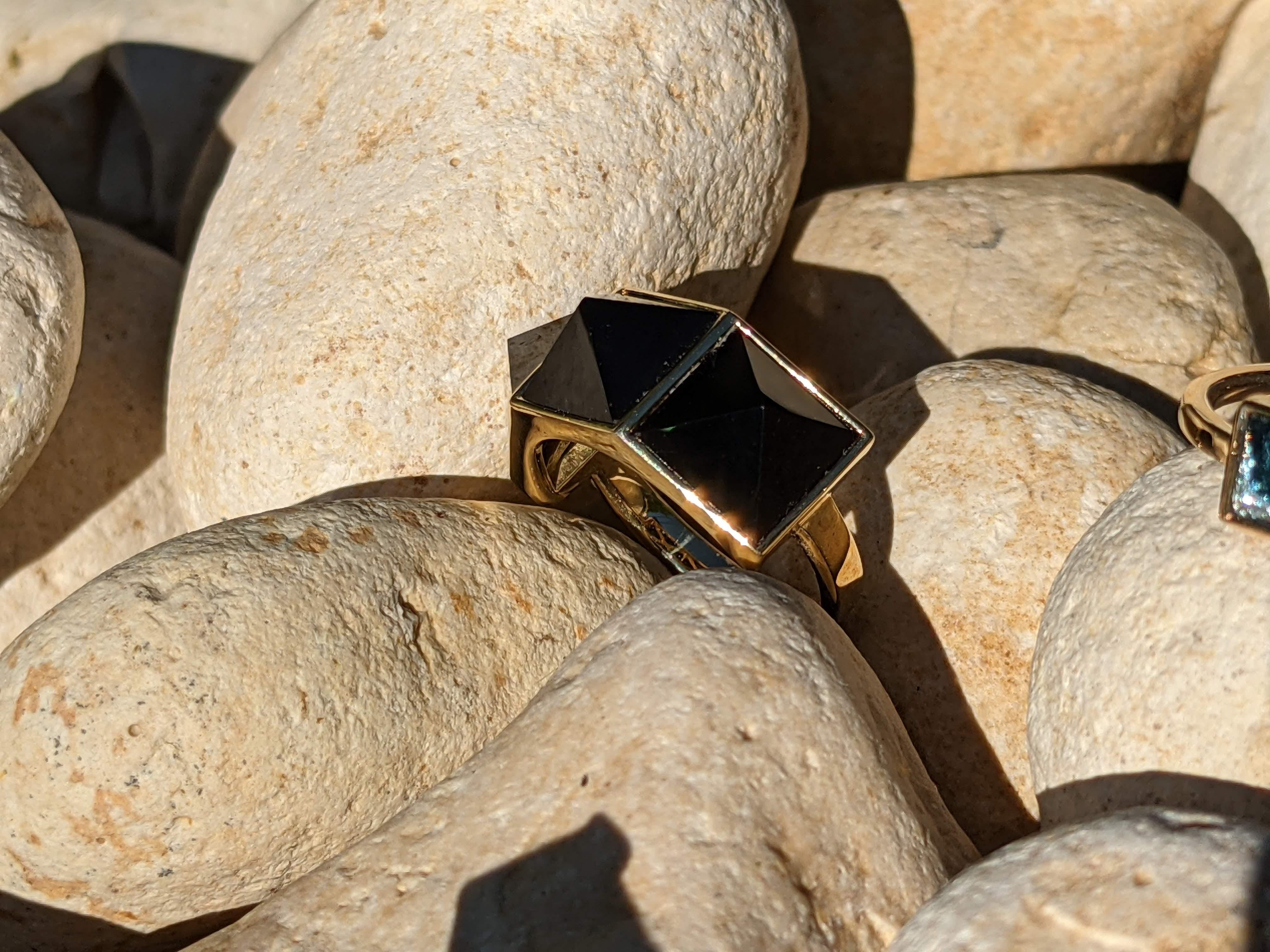 Pyramid collection, the Three Pyramid Black Onyx ring in 18k yellow gold, manufactured in New York.

Onyx is believed to offer personal protection and relationship harmony and The Pyramid symbolizes bigger consciousness of strength and energy.

For