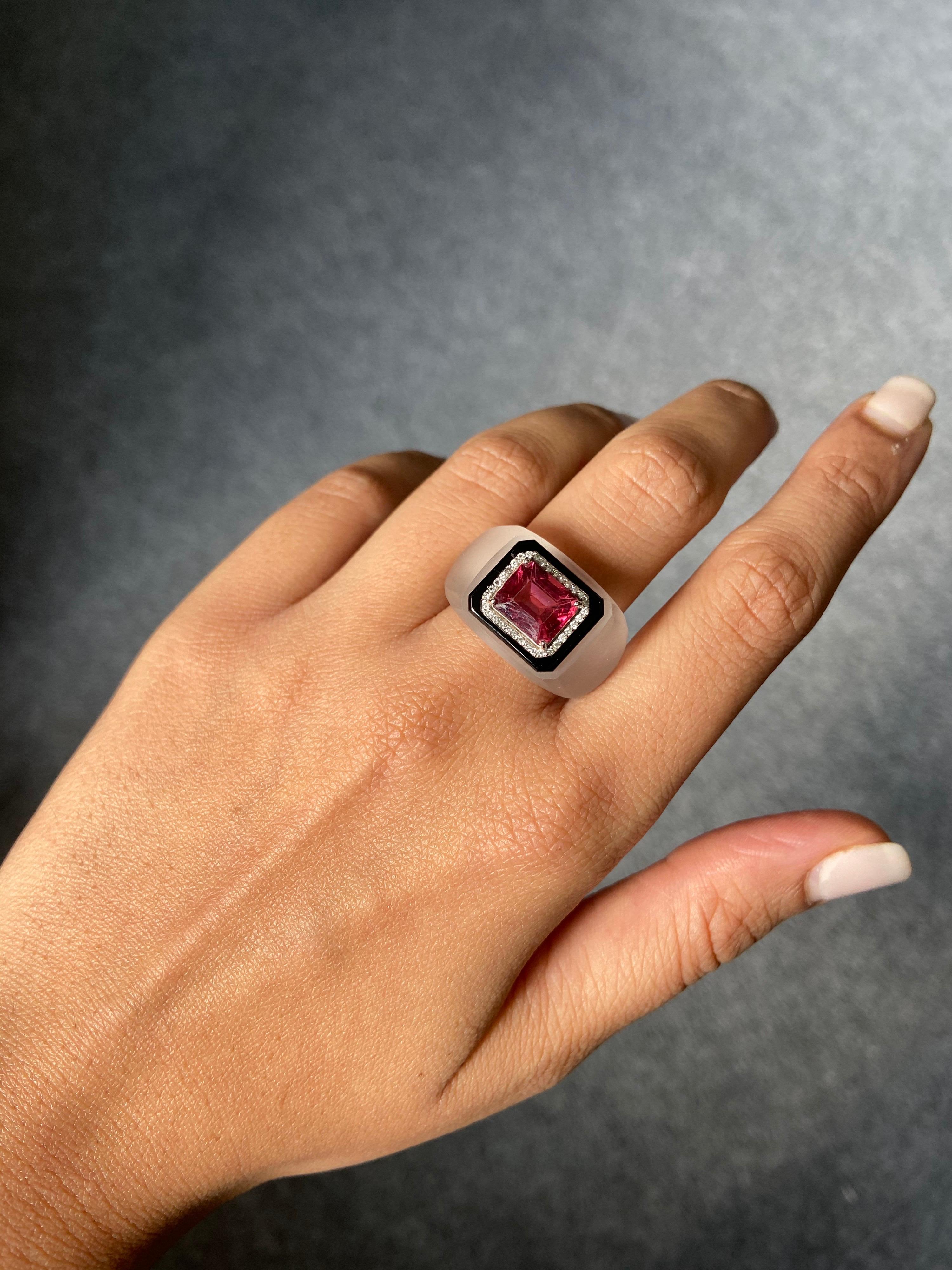 One of a kind art-deco vibe emerald cut Tourmaline ring, set in 18K white gold with Diamonds, black onyx and Rock Crystal. The ring is currently sized at US 7 - customization is available. 
Please feel free to message us if you have any queries.