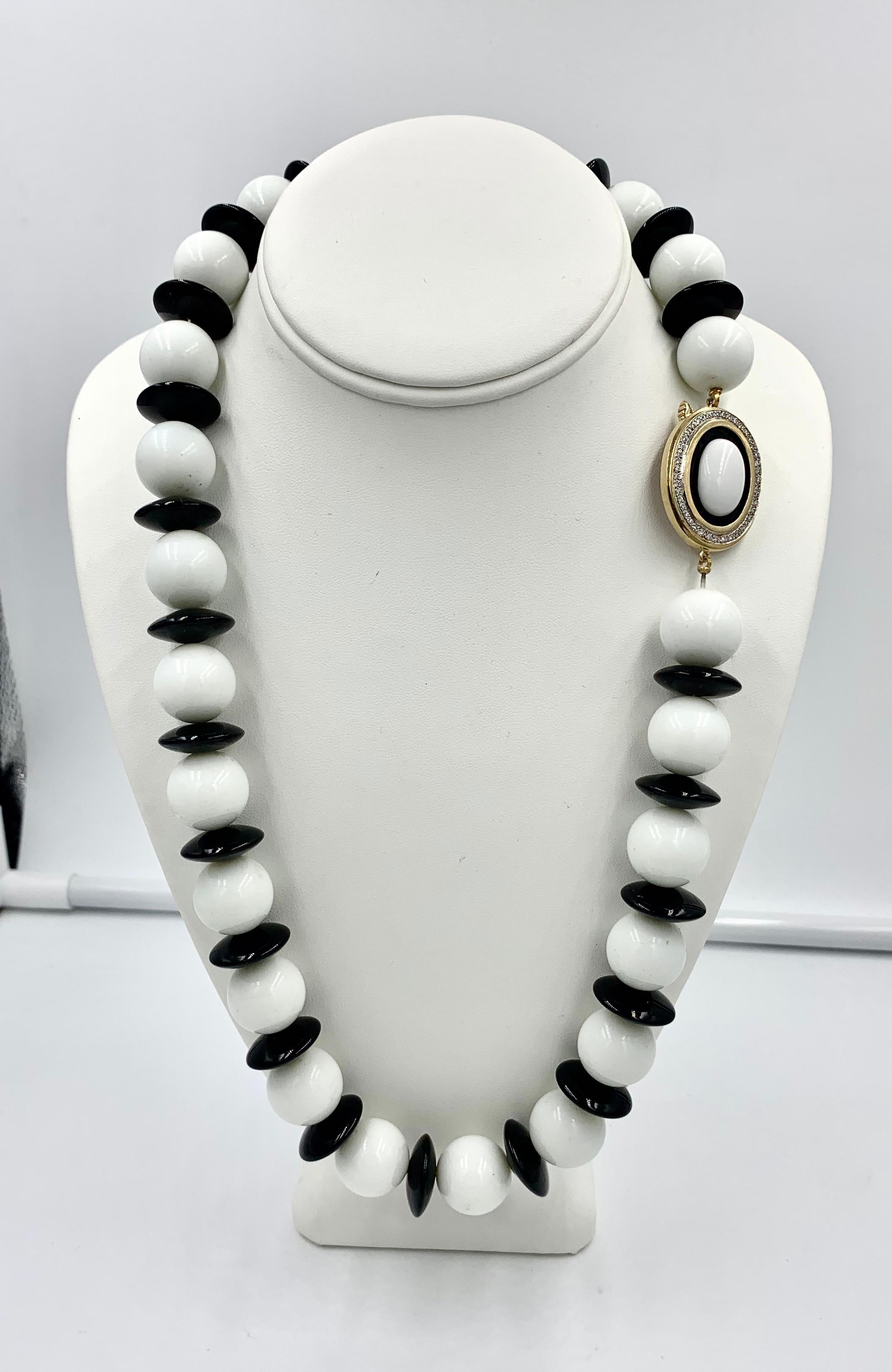 This is one of the finest and most dramatic Black and White Onyx and Diamond Necklaces we have seen.  The large White Onyx beads alternate with smooth Black Onyx discs to create a cascade of incredible jewels.  The clasp features a white onyx