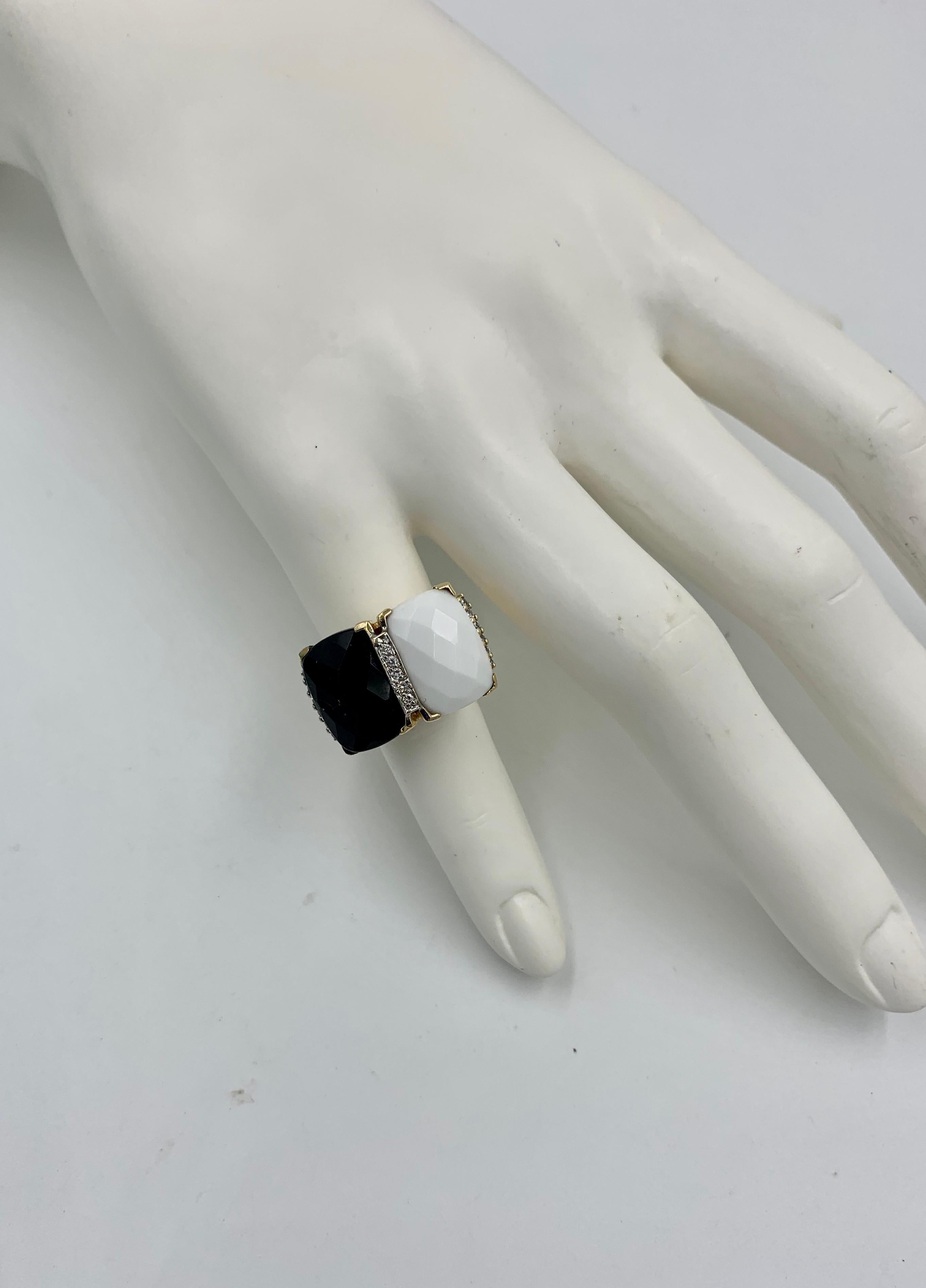 A classic Retro Ring with Black Onyx and White Onyx rectangular checkerboard cut gems.   The vivid Onyx is accented by 15 sparkling white Diamonds.  I just love the dramatic black and white Onyx together with the diamonds.  The jewels are set in 14