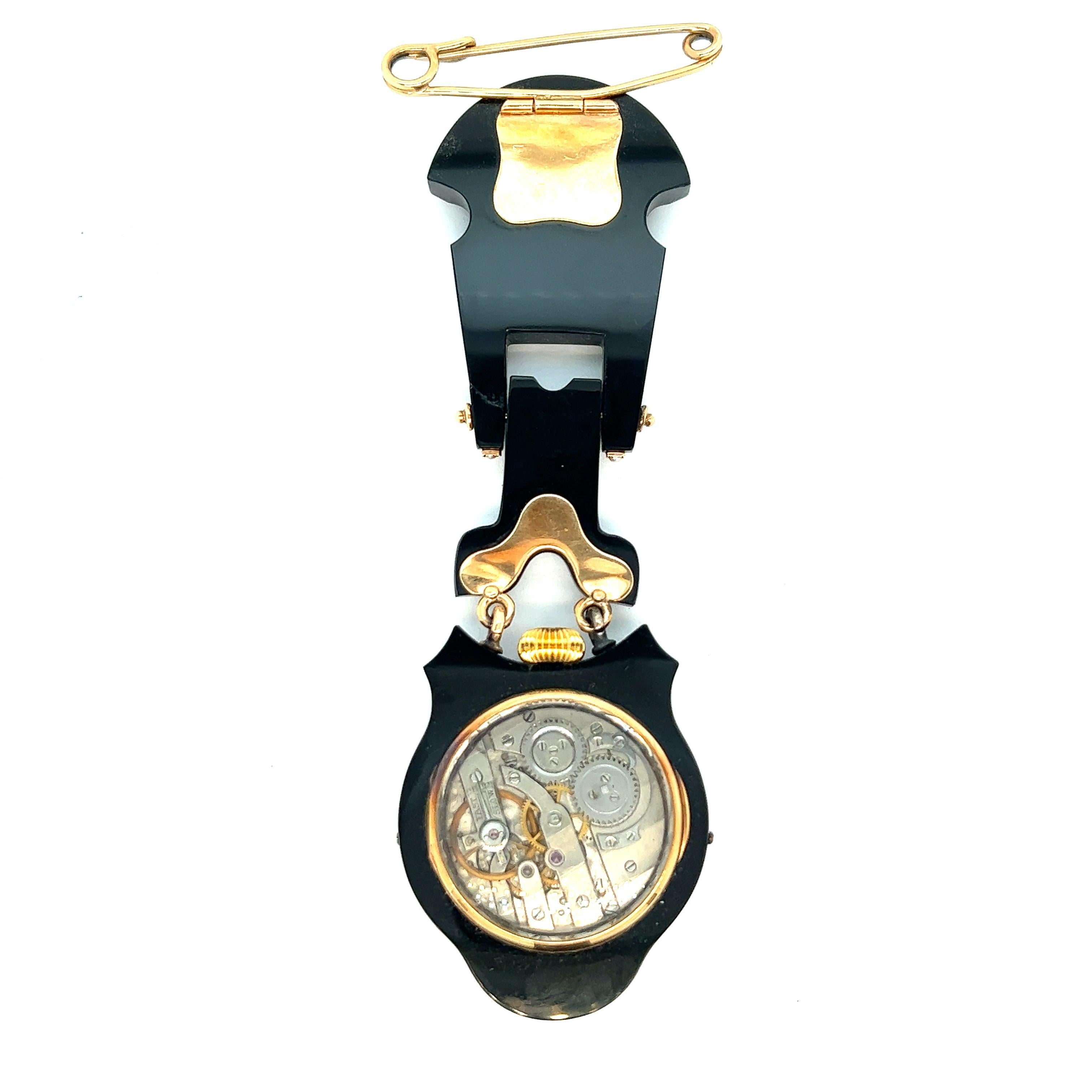 Black onyx with pearls lapel mourning watch

18k yellow gold bezel and hinges; bezel and accent trim work set with seed pearls; overall size 1.44 inches width, 4.56 inches length; total weight 63.2 grams

Comes in a Tiffany & Co. fitted custom box;