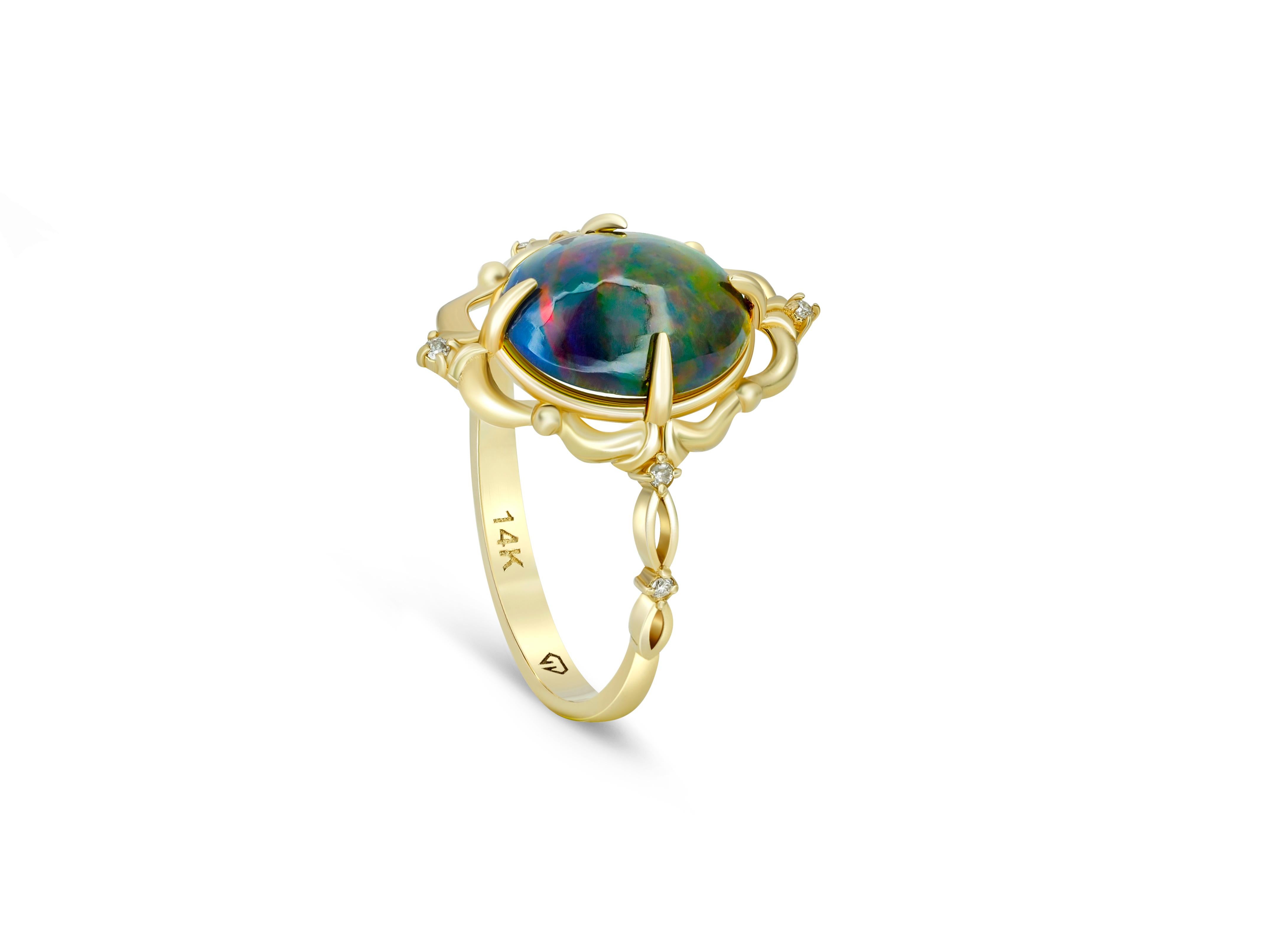 Oval Cut Black opal 14k gold ring. For Sale