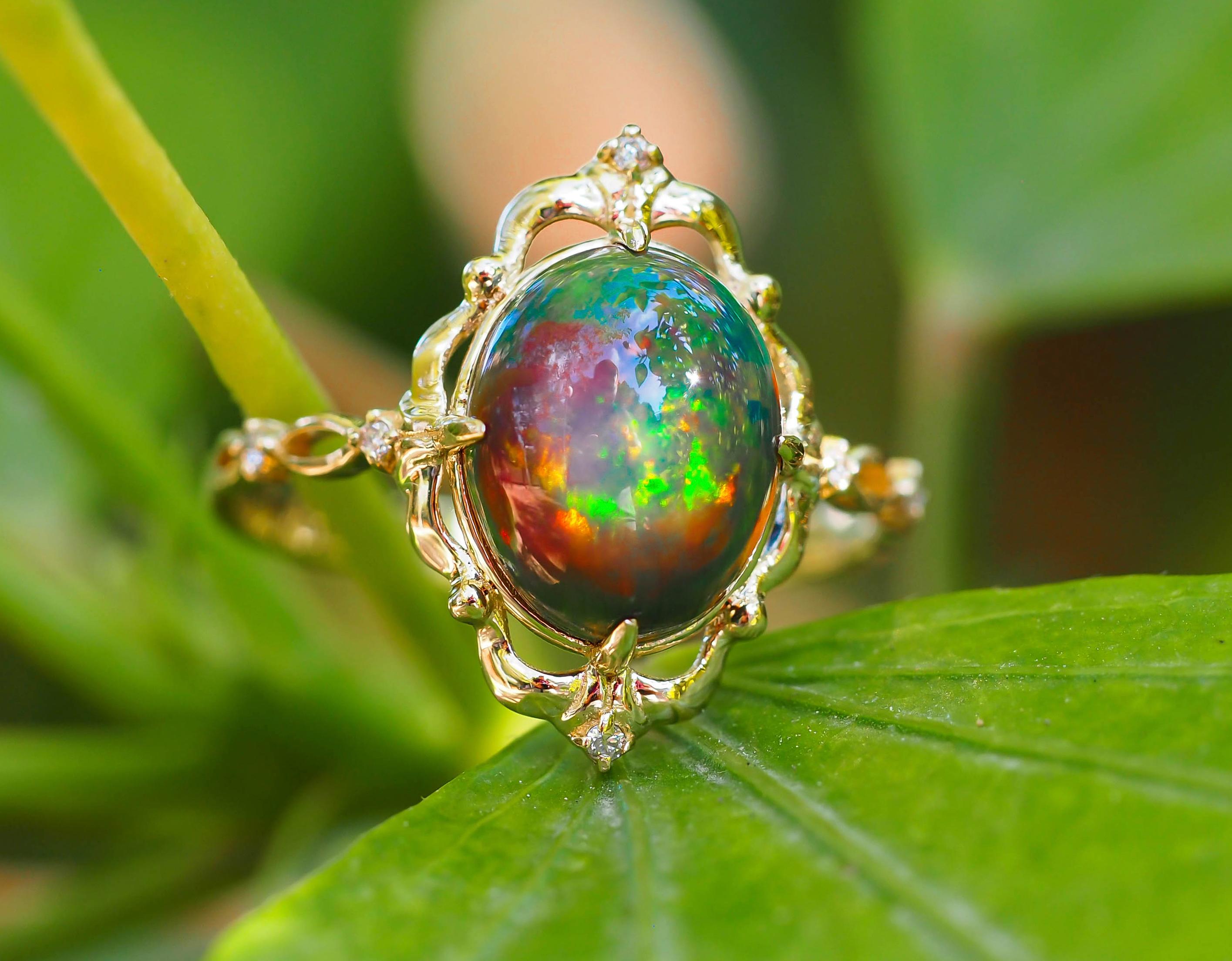 Oval Cut Black opal 14k gold ring.  For Sale