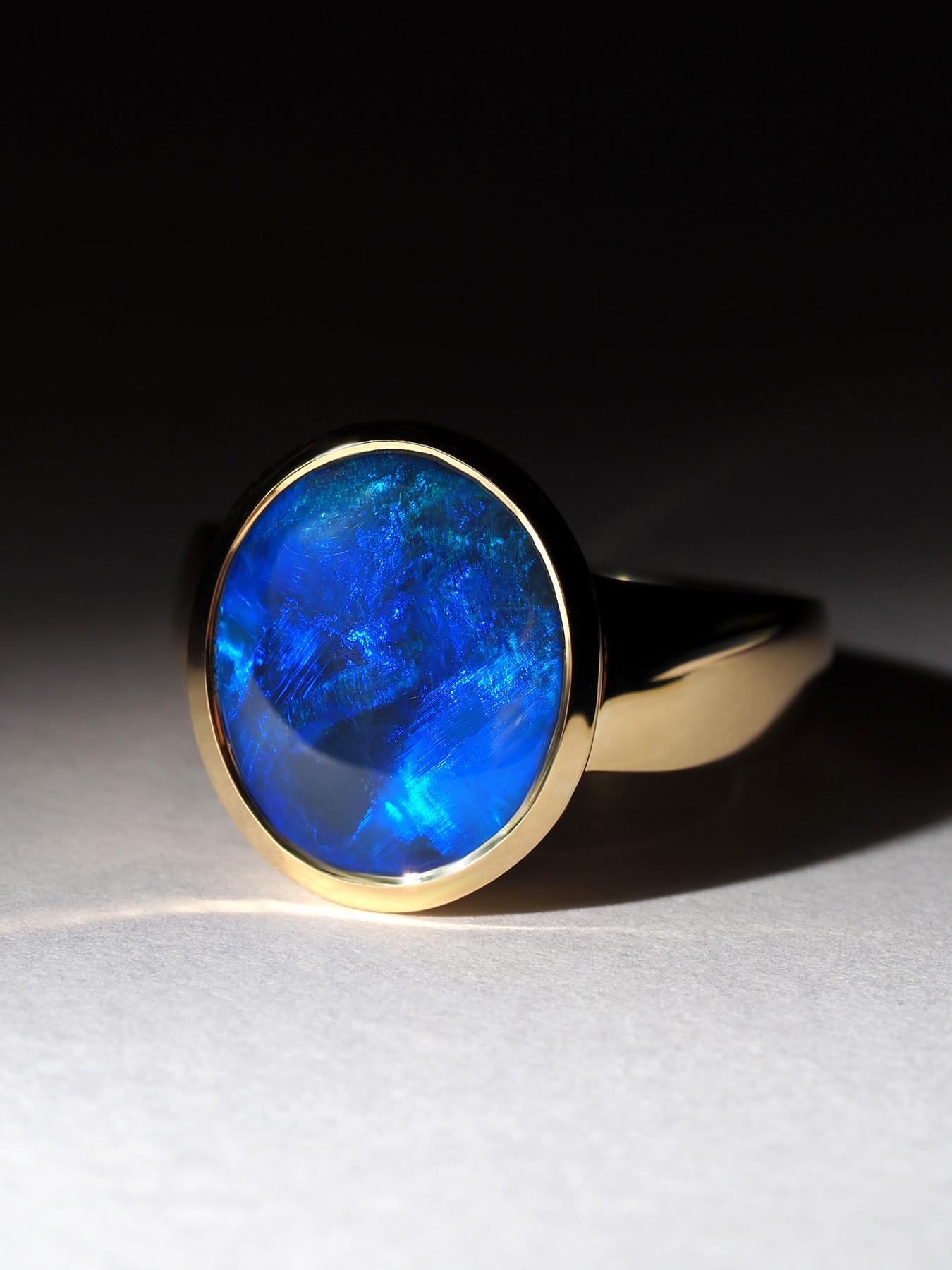Bague en or 18K en opale noire, peut être une bague de fiançailles parfaite
Poids de l'anneau - 7.4 gr
taille de la pierre précieuse opale - 11 x 13 mm
poids de l'opale - 4 ct
taille de la bague - 56 / 7,5 US / diamètre 17 3/4, taille française - 16