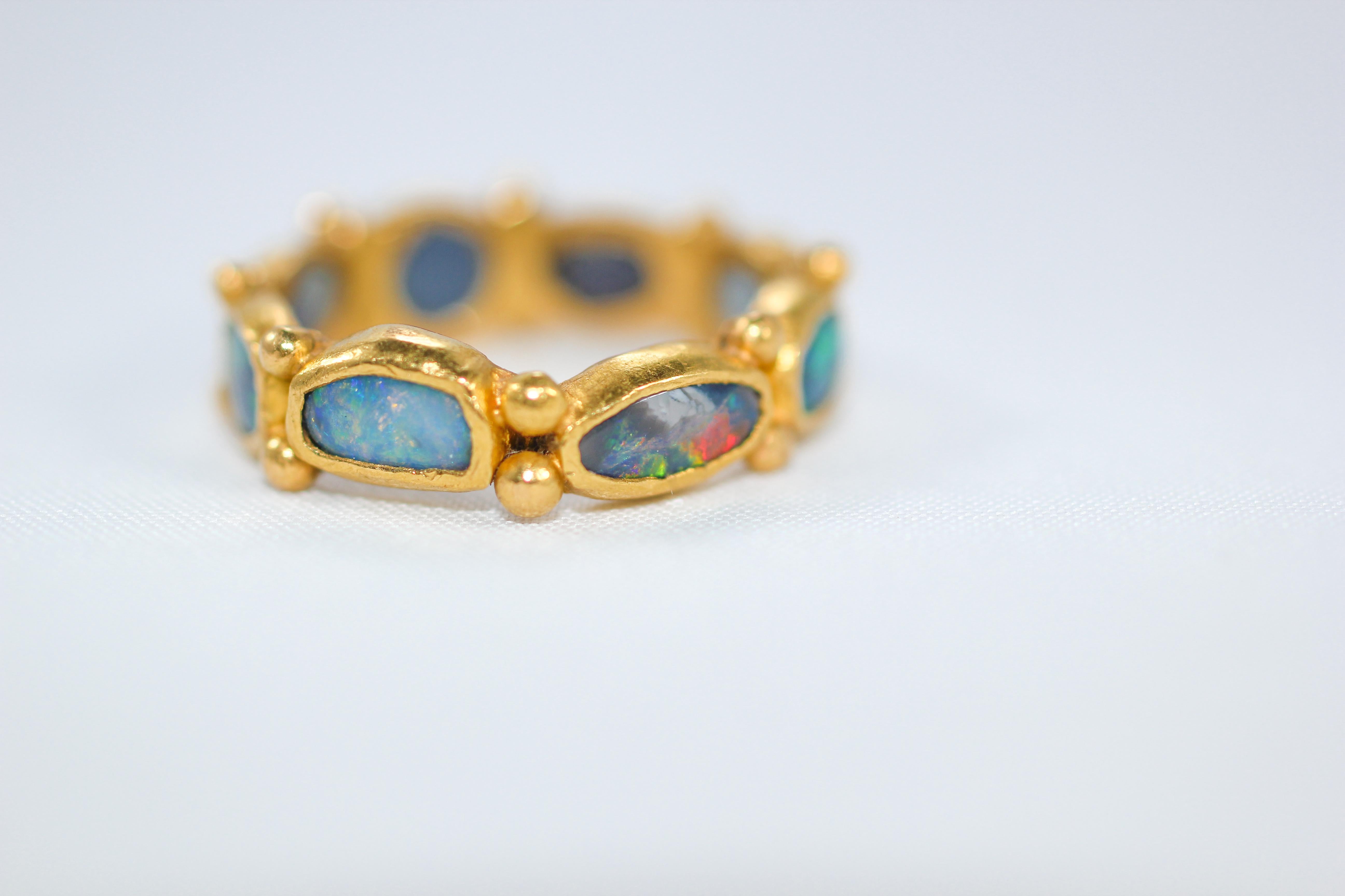 Custom listing. One-of-a-kind handmade 21Karat gold fashion band ring. Rich and exotic black opals are bezels set in solid 21k yellow gold creating a bright and interesting conversation piece. We love using opals in our designs. They are full of